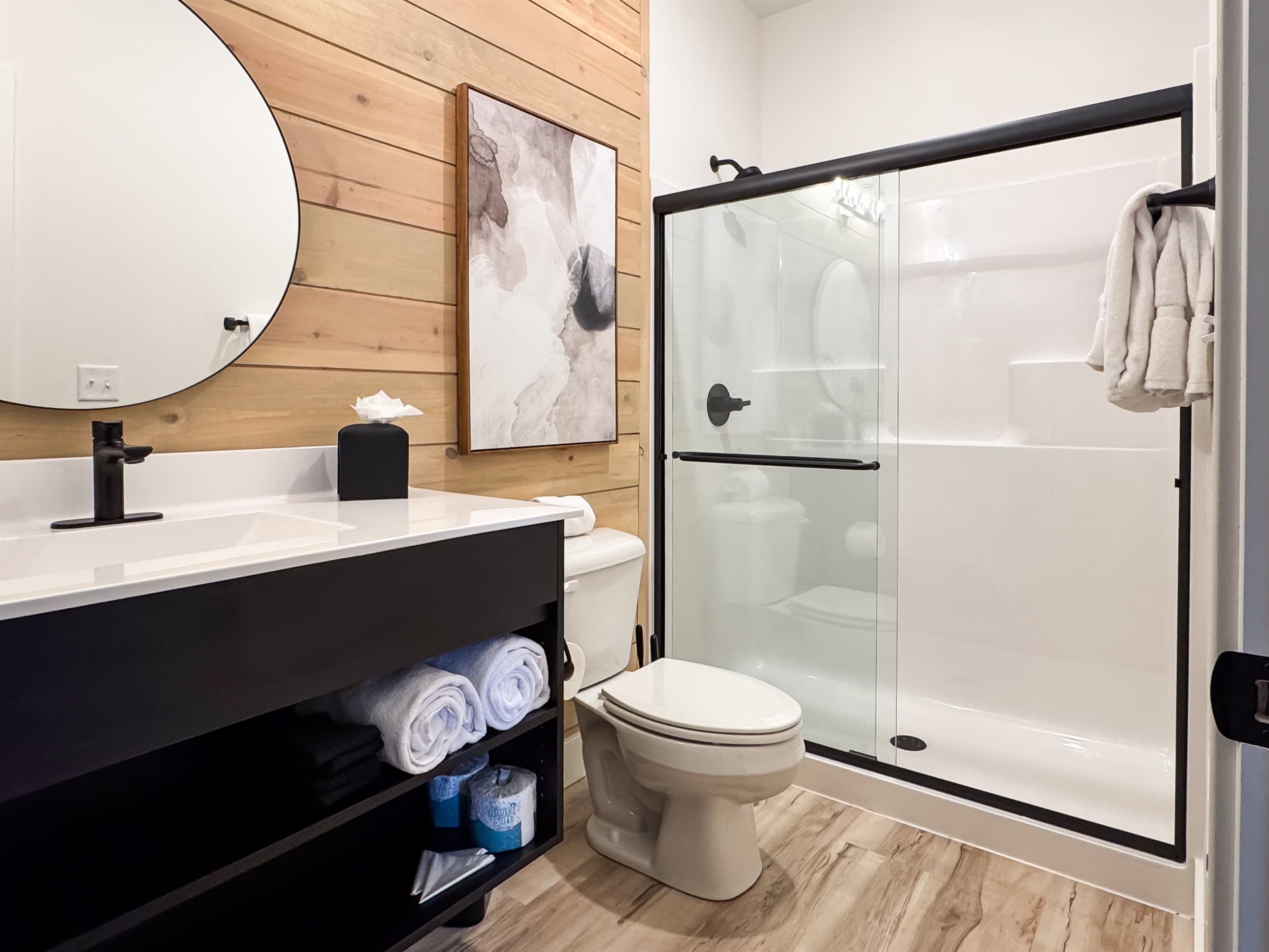 Bedroom 3: En-suite bathroom with low curb shower, toilet, and vanity
