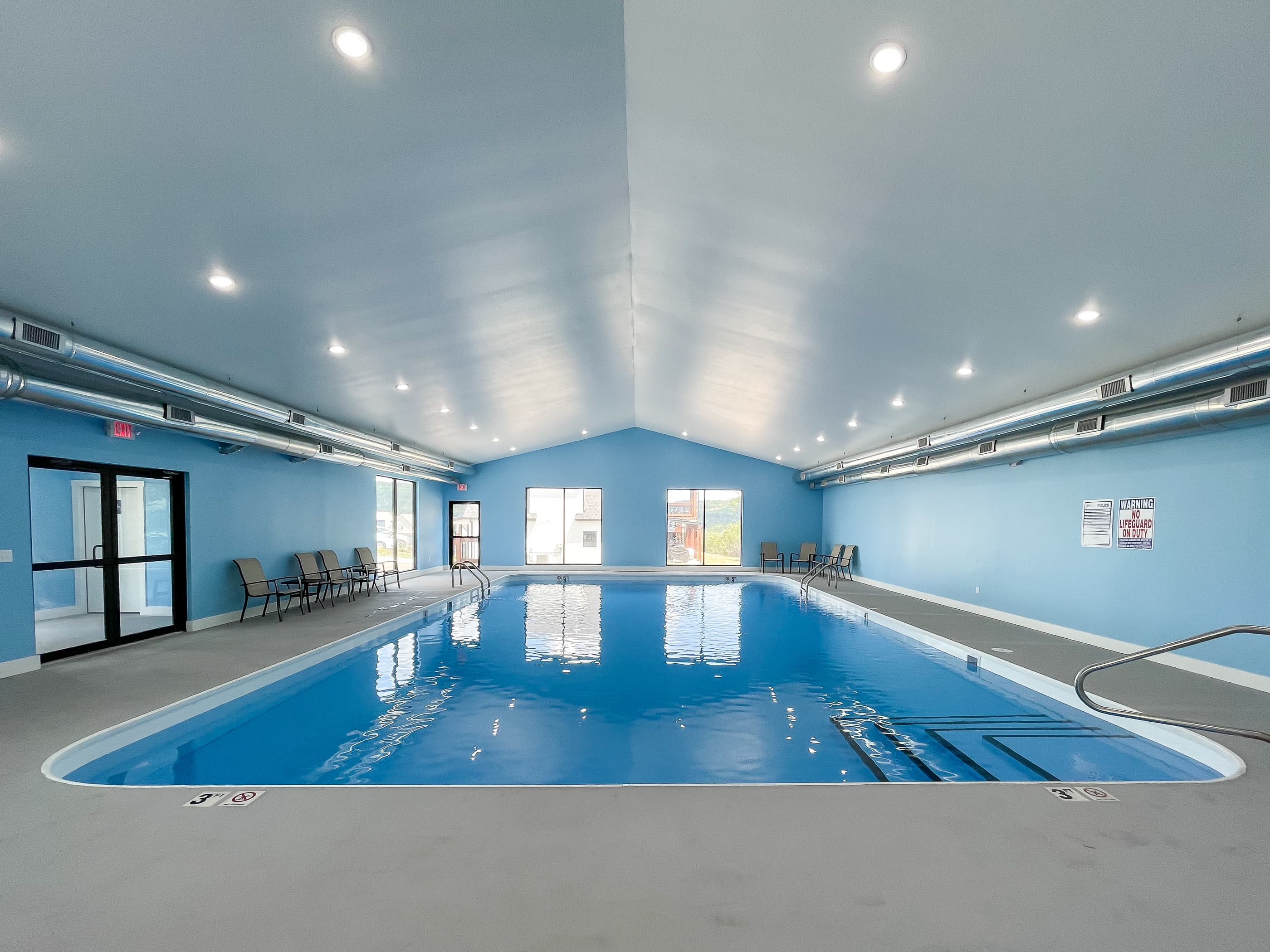 Indoor pool area with seating