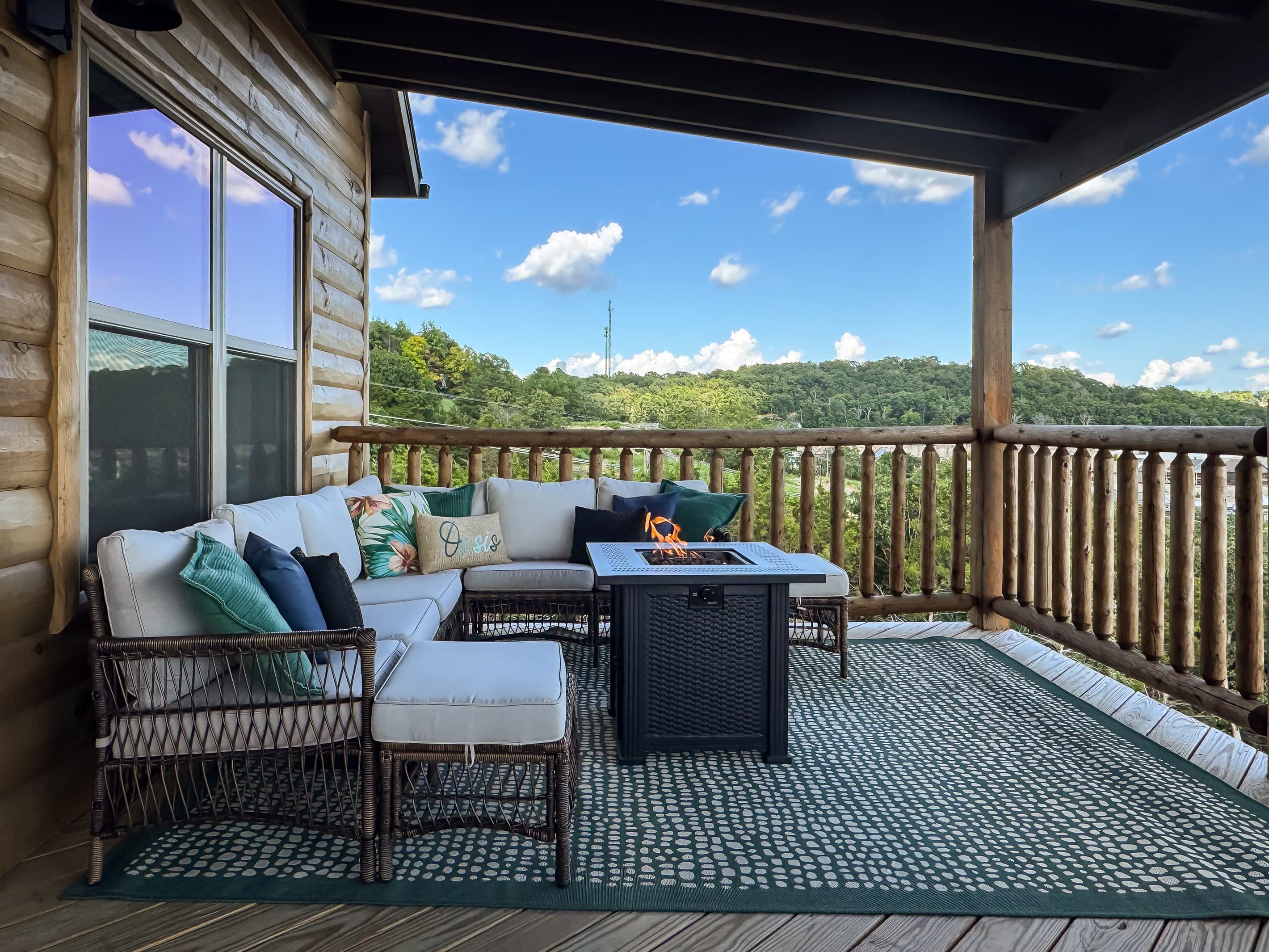 Sectional seating with gas fire pit with scenic view from the upper deck