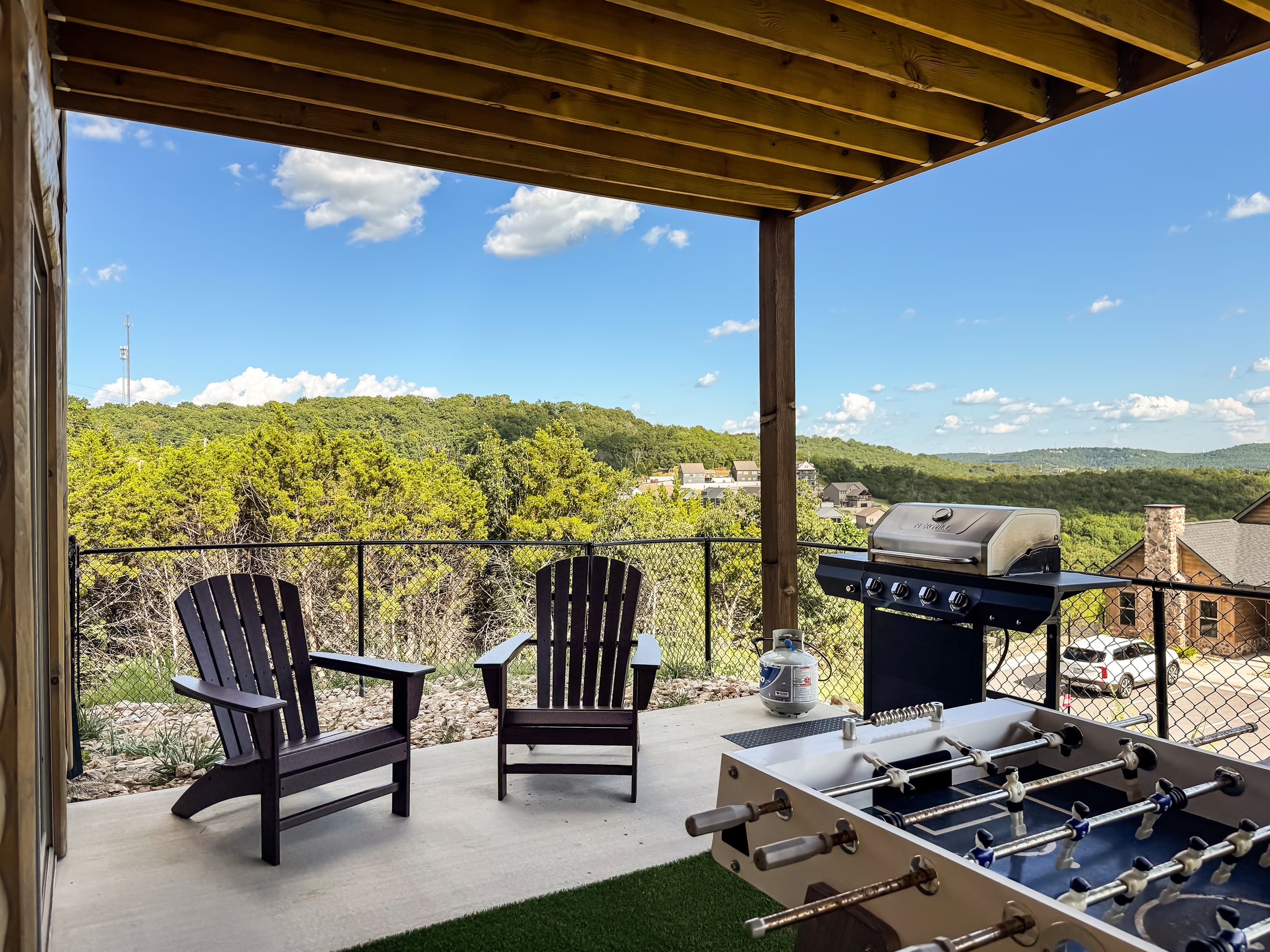 Lower level patio with seating and gas grill