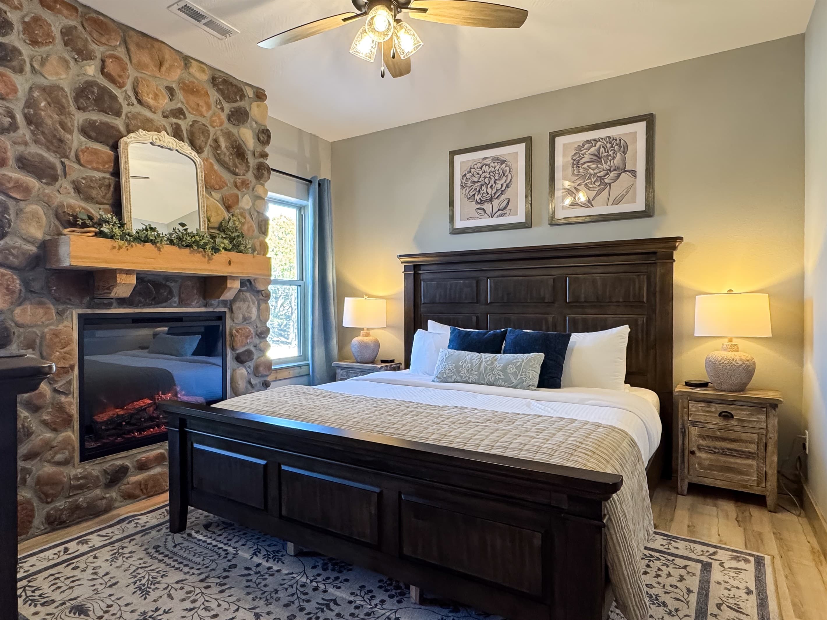 Bedroom 2 (lower level) King size bed with an electric fire place