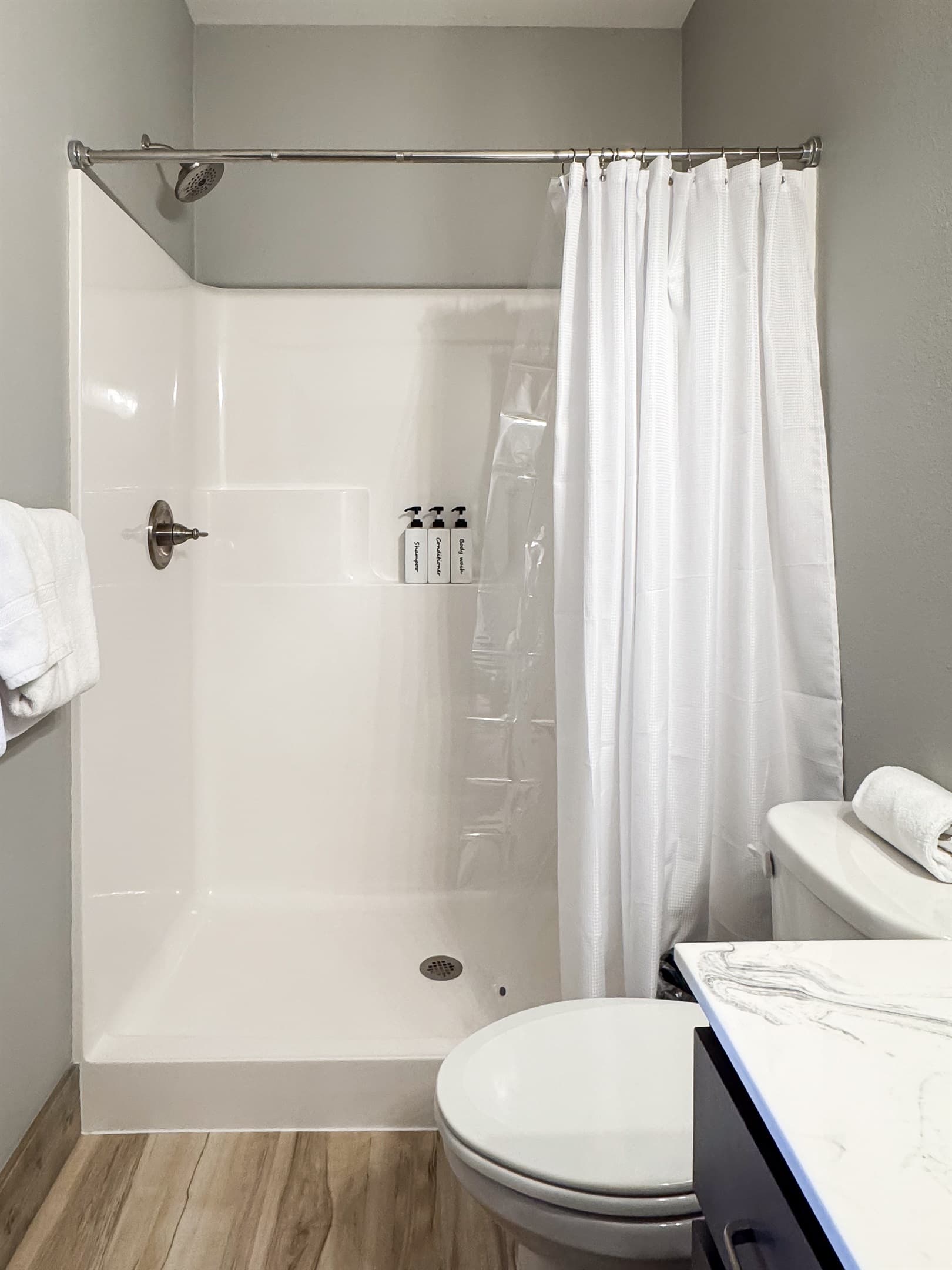 Low threshold shower with soap provided