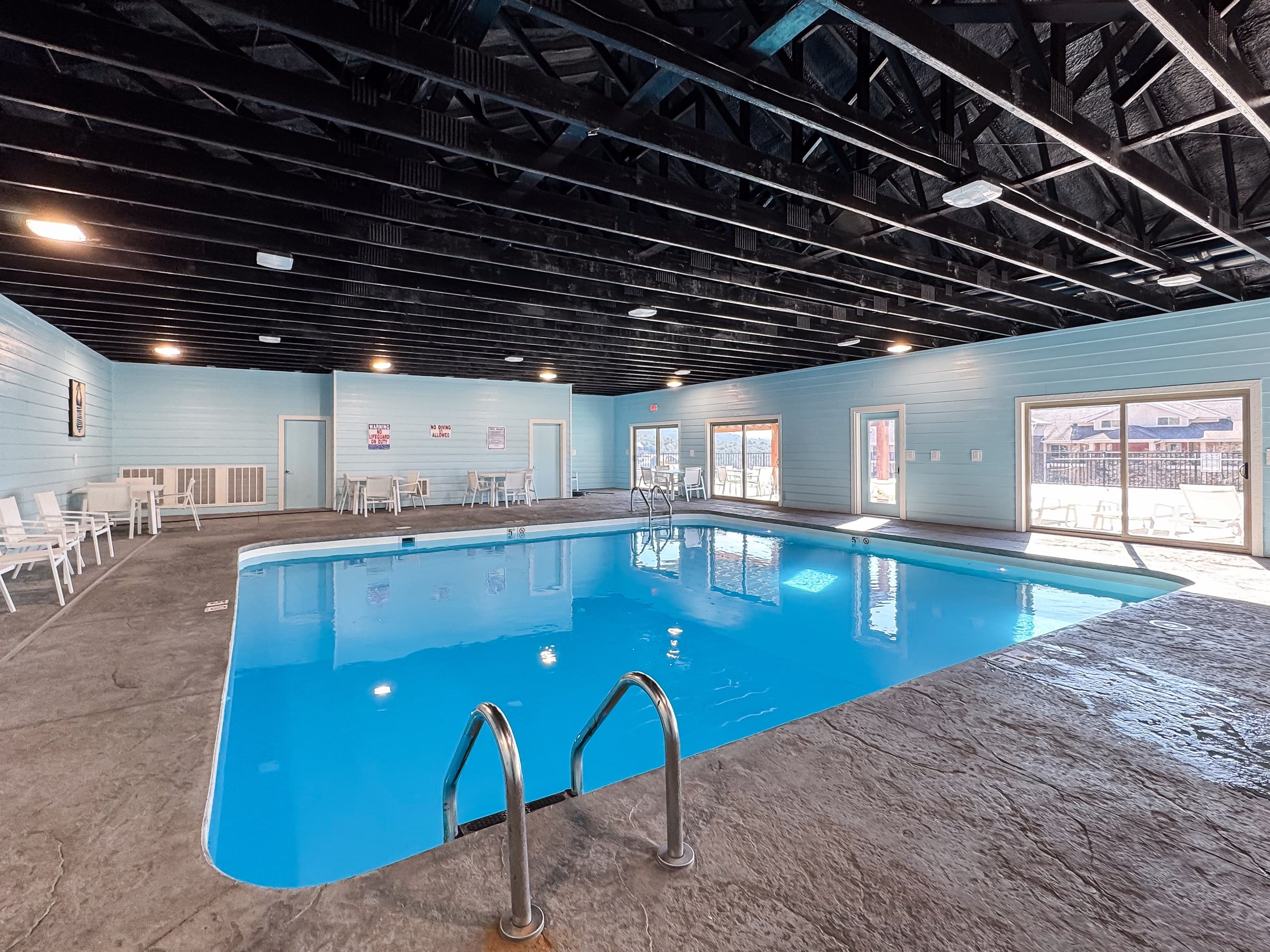 Handle bar and stairs to get in on both ends of the pool
