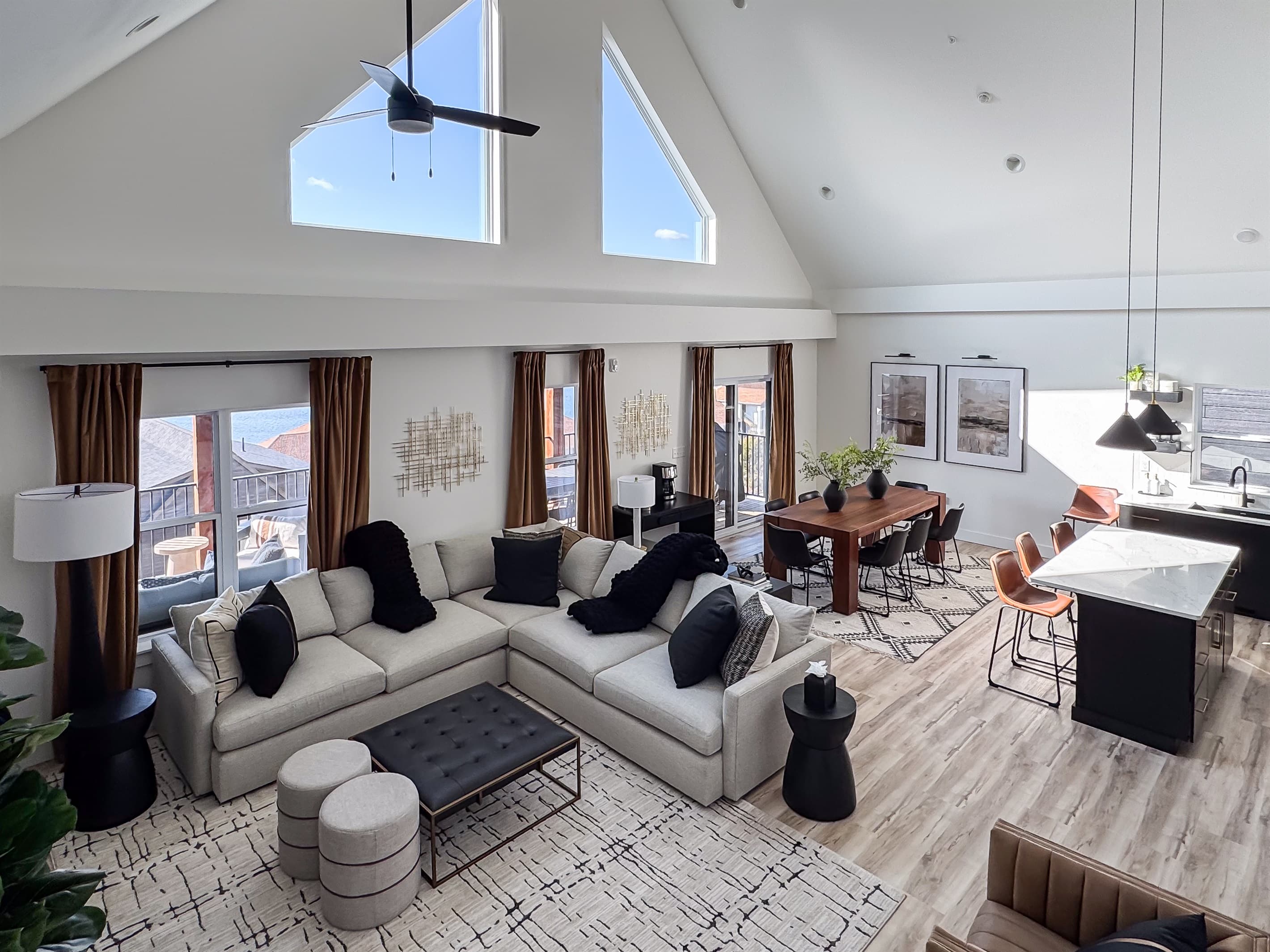 Overview of the living room, dining area, and kitchen
