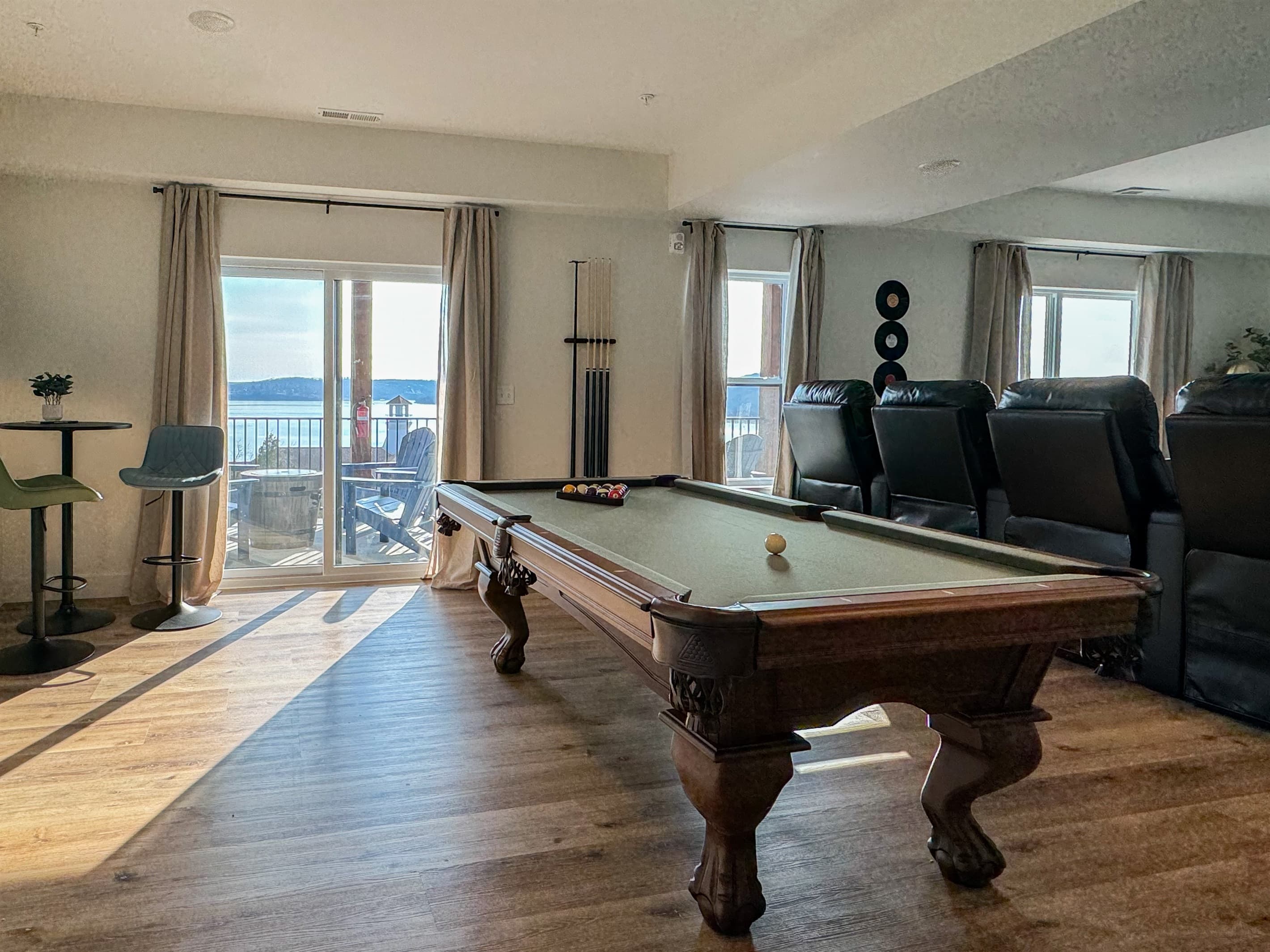 Right behind the theater is the game room with access to to the lower deck