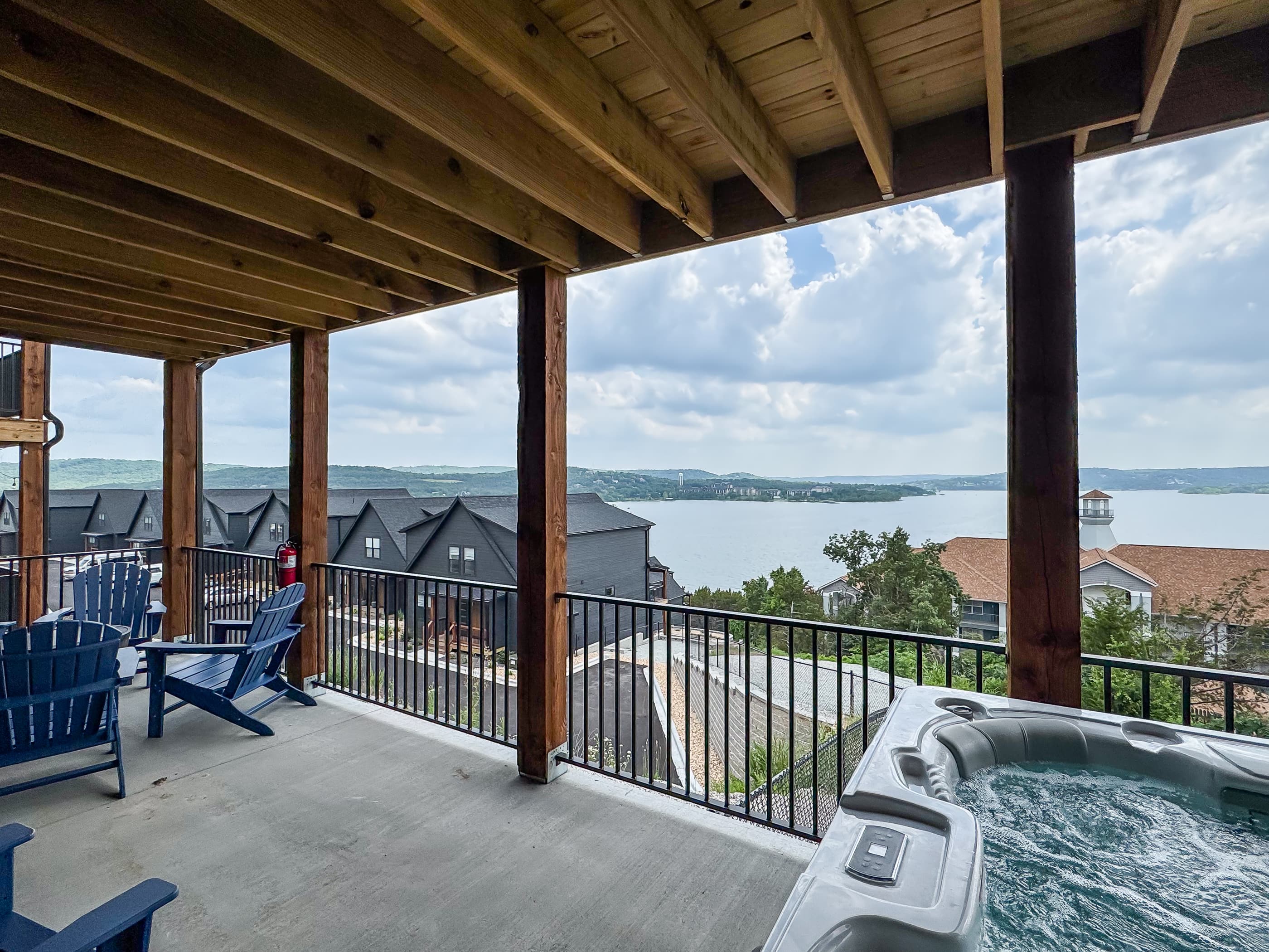 Lower deck with hot tub and seating around a firepit