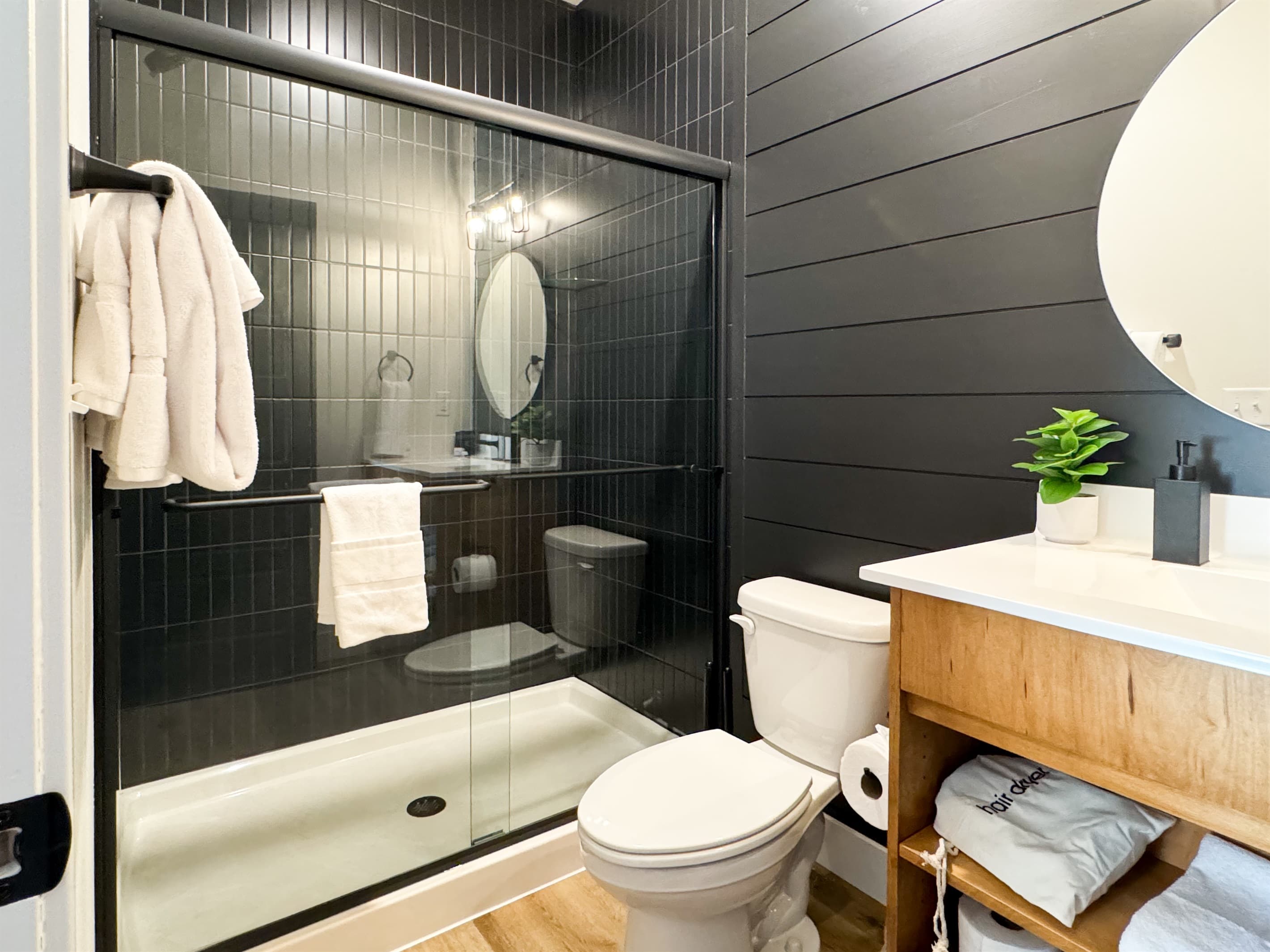 Bedroom 1: En-suite shower low curb, toilet, and vanity