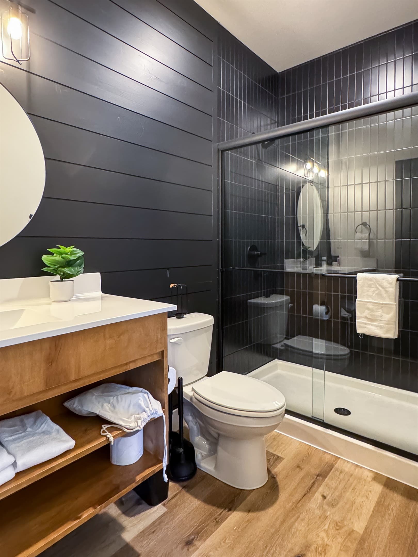 Bedroom 6: En-suite bathroom with low curb shower, toilet, and vanity