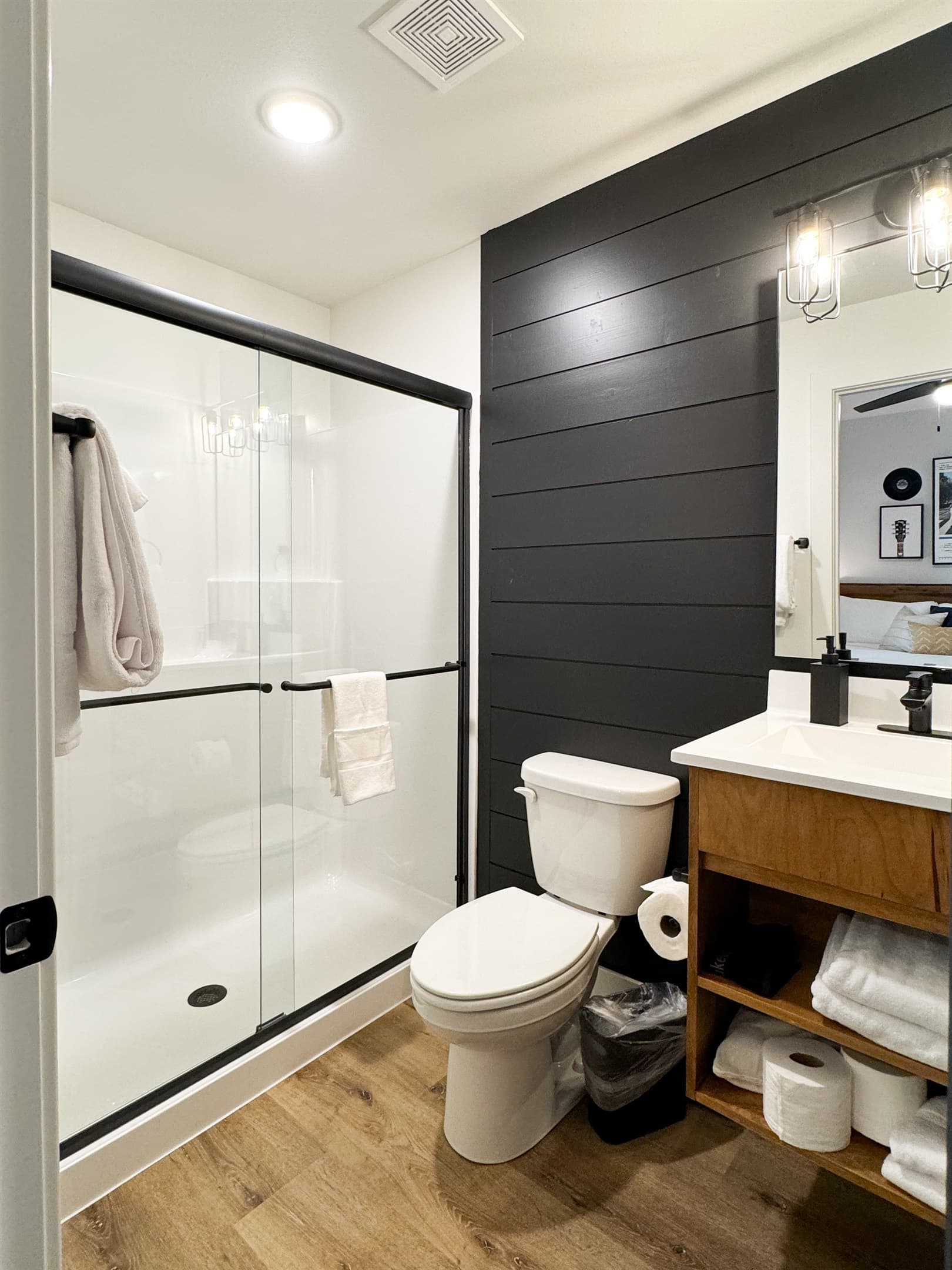 Bedroom 3: En-suite bathroom with low curb shower, toilet, and vanity