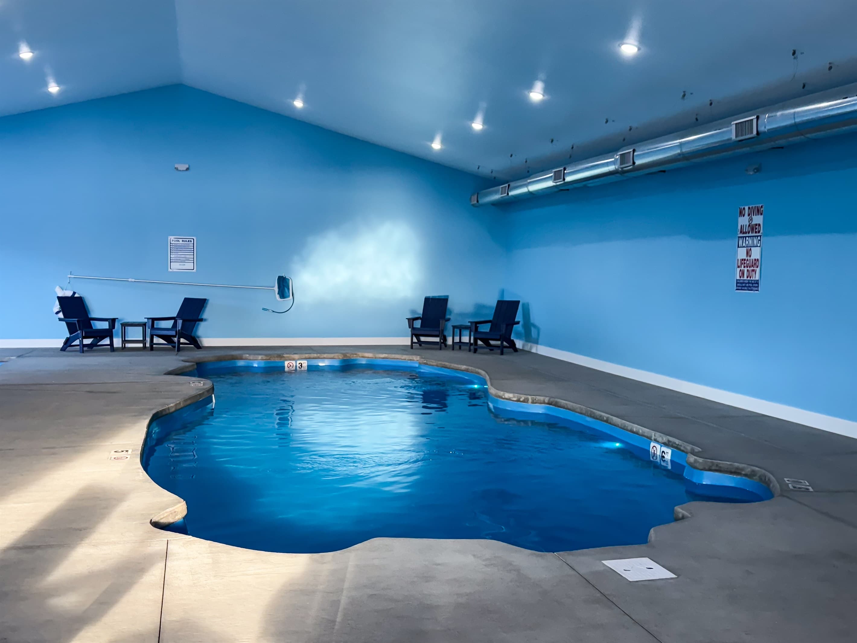 Indoor pool area with seating