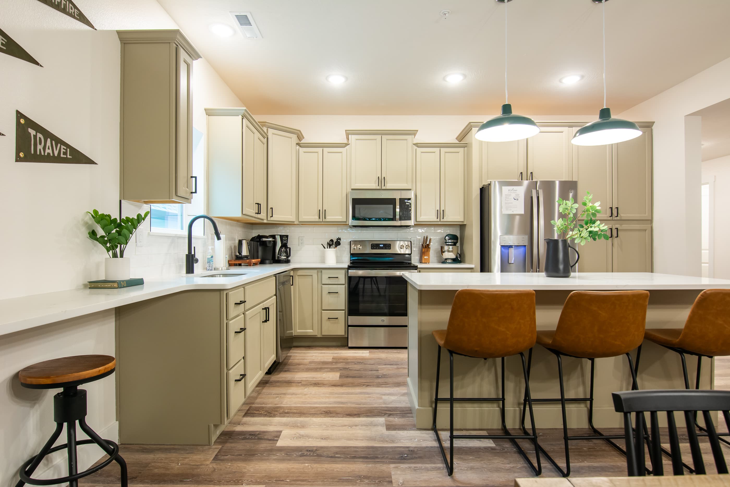 Kitchen with island providing more seating
