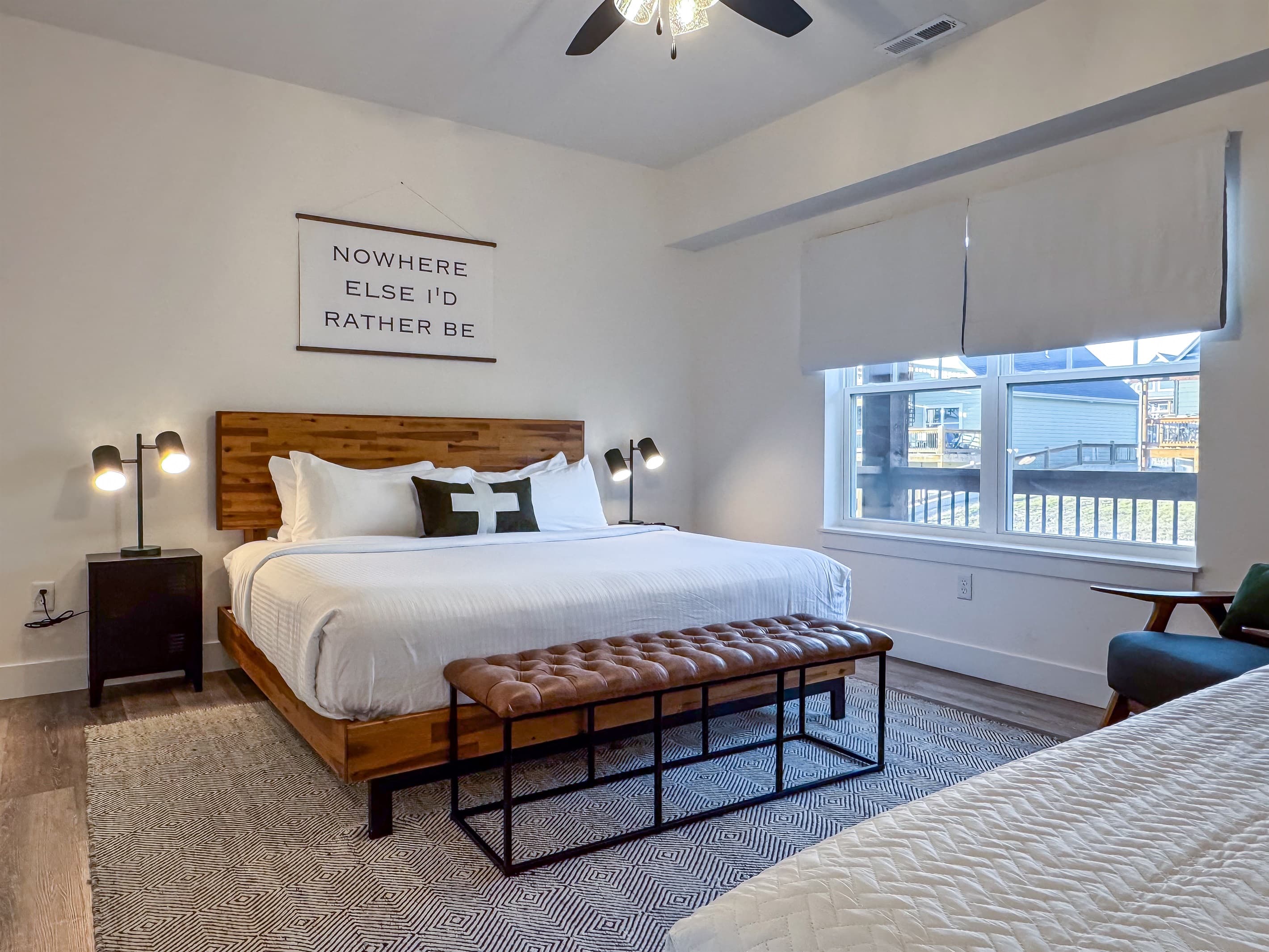Bedroom 2 (main level): King bed with two nightstands and twin bed