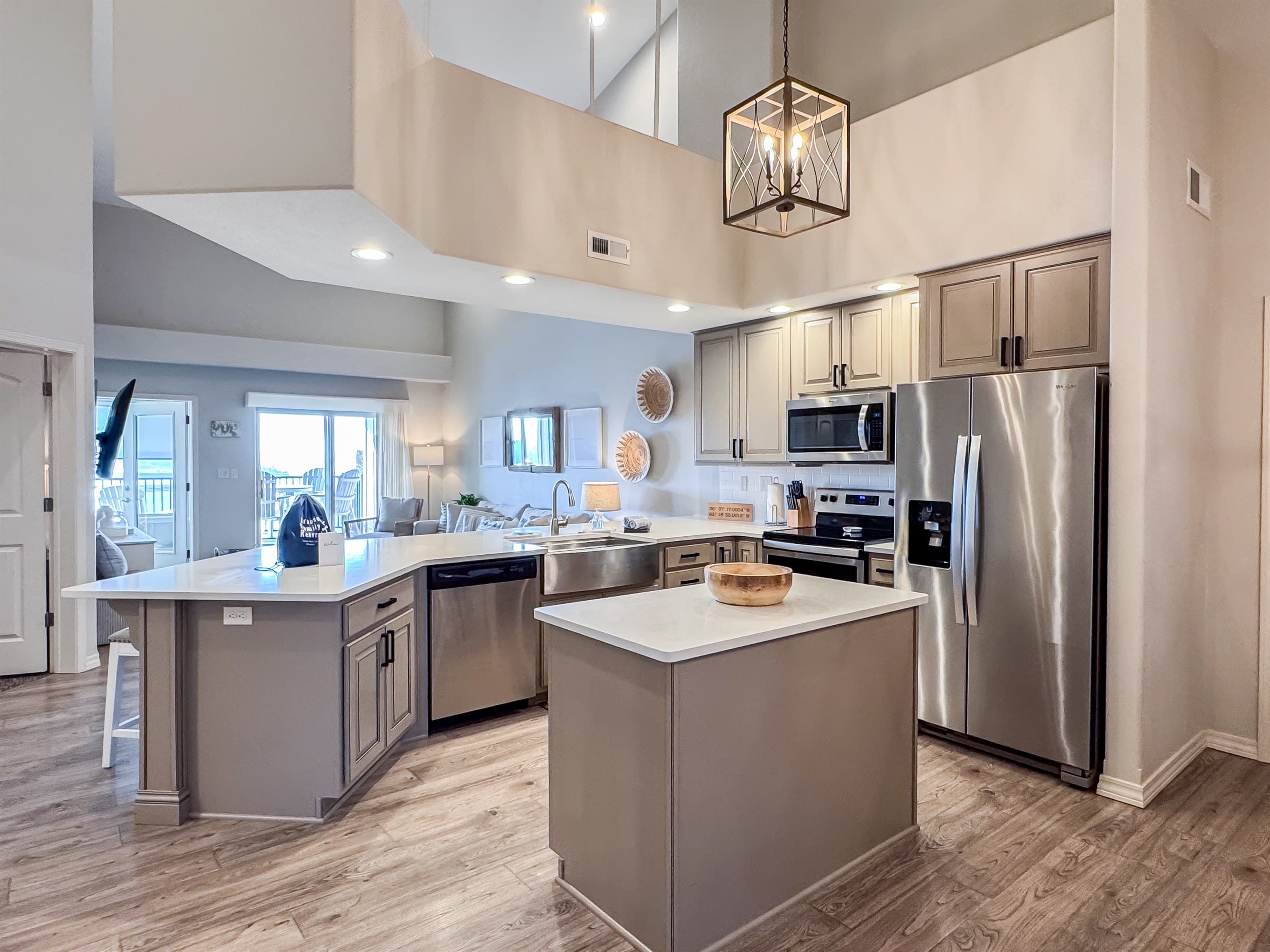 Kitchen overview with island and welcome bag for guests to enjoy