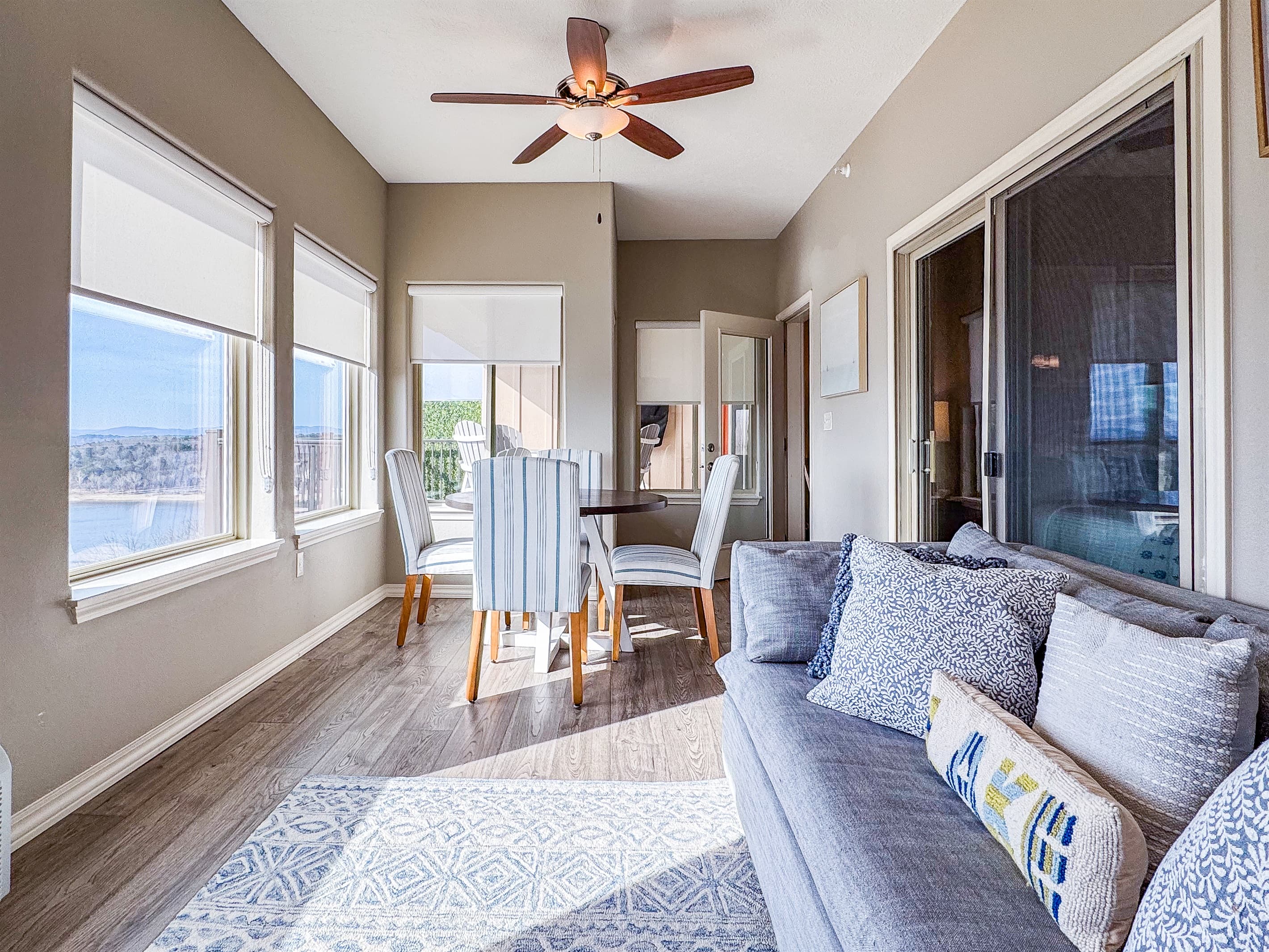 Sunroom with couch seating and another seating option to eat at with a view