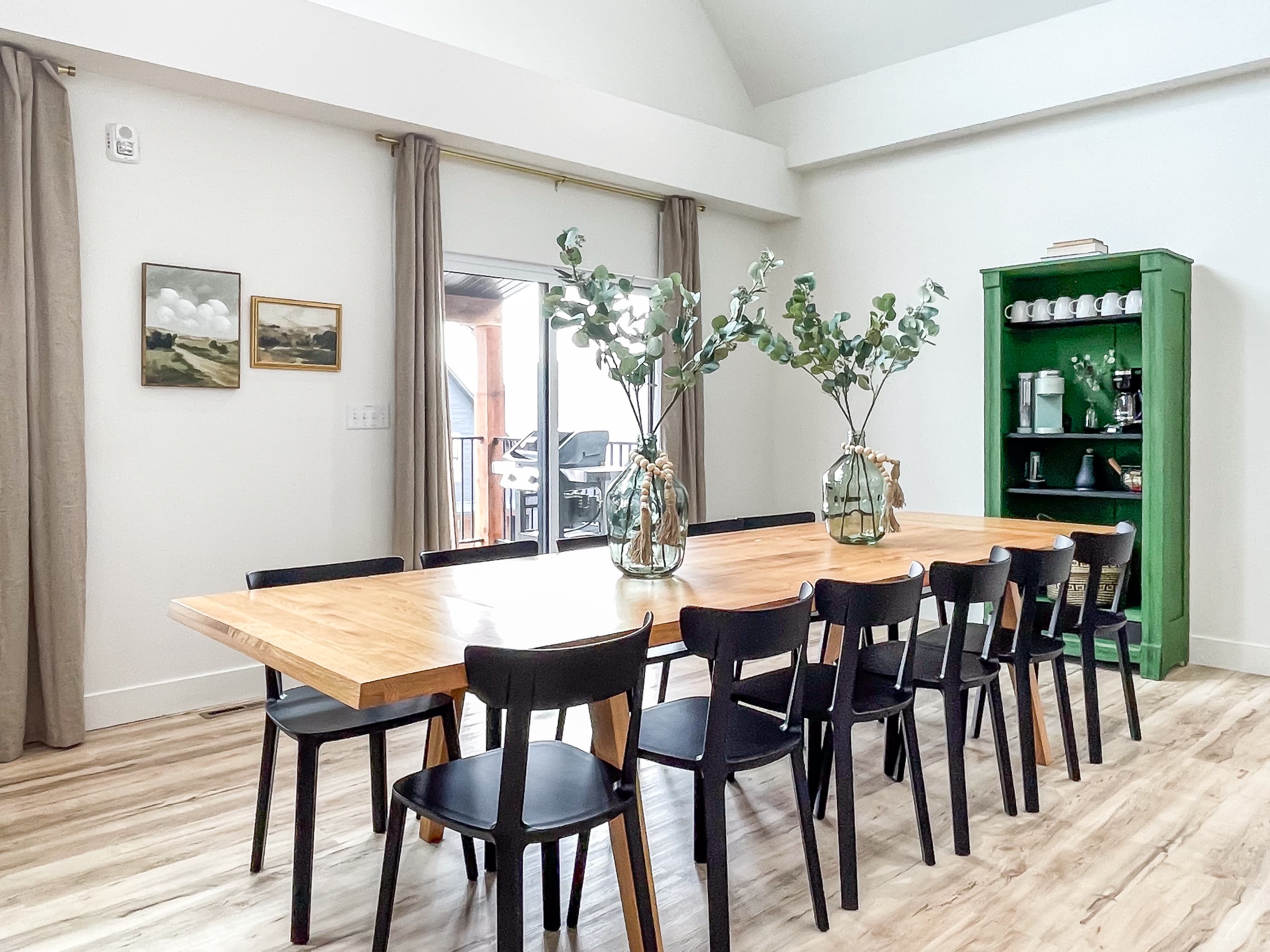 Light and open dining area with ample seating and main level deck access