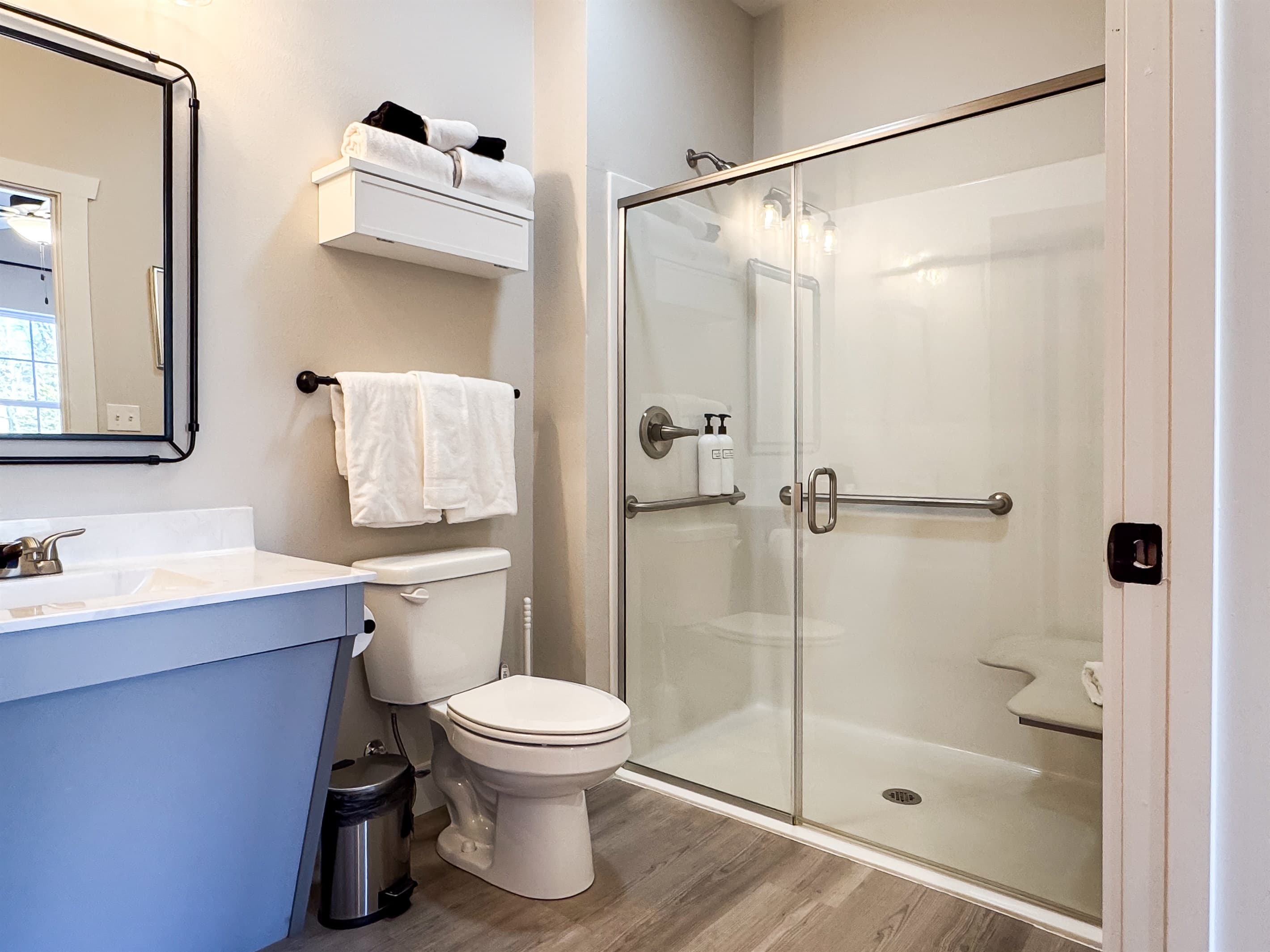 Some accessibility features including grab bars in shower, built in shower chair, and accessible sink