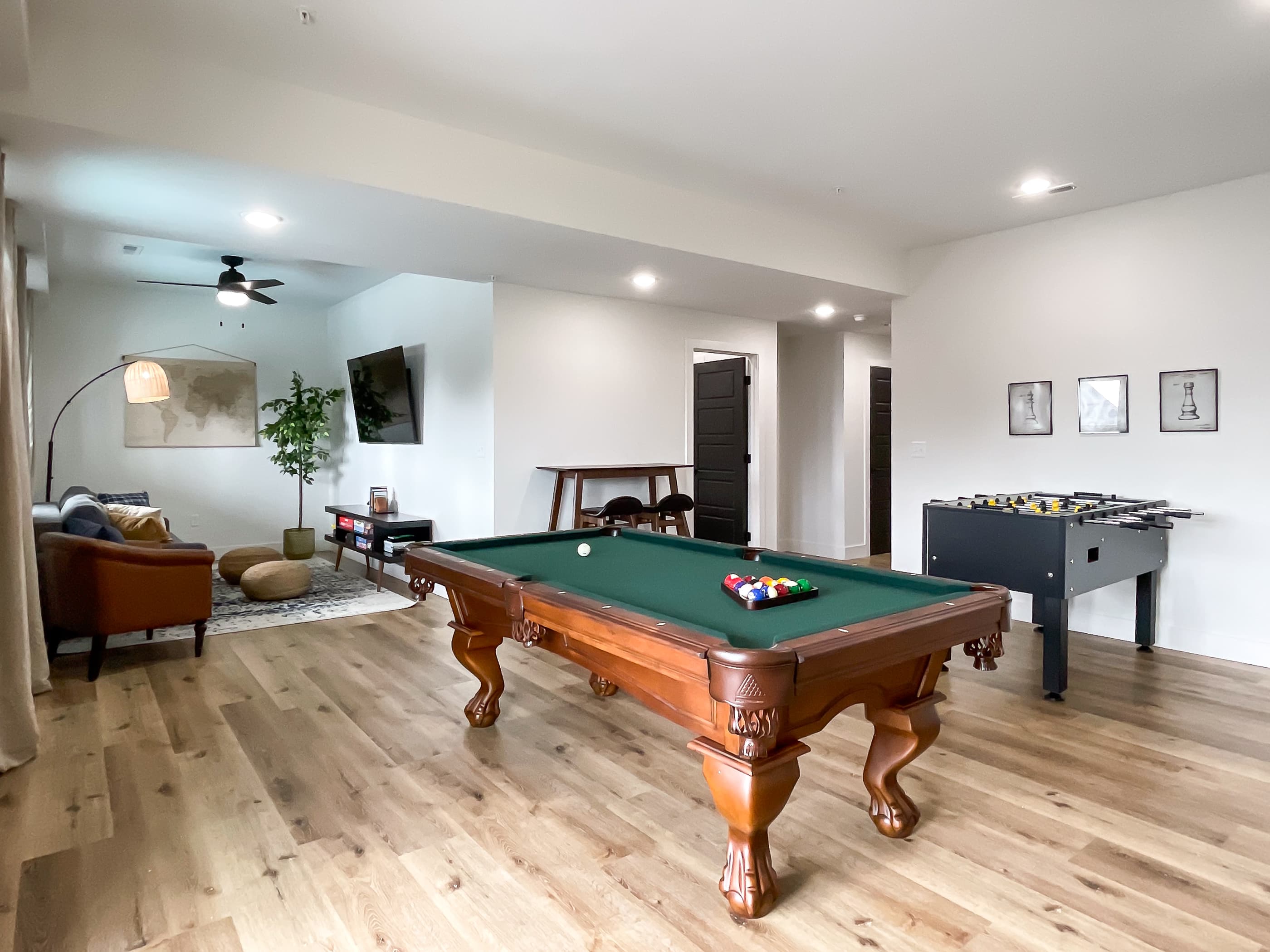 Lower level game room with pool table, foosball, and board games