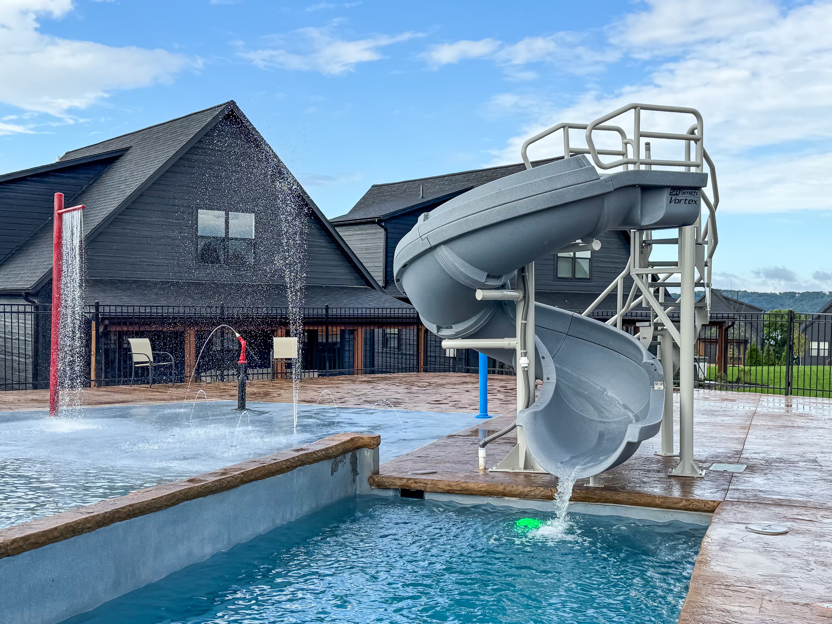 Outdoor pool with water slide