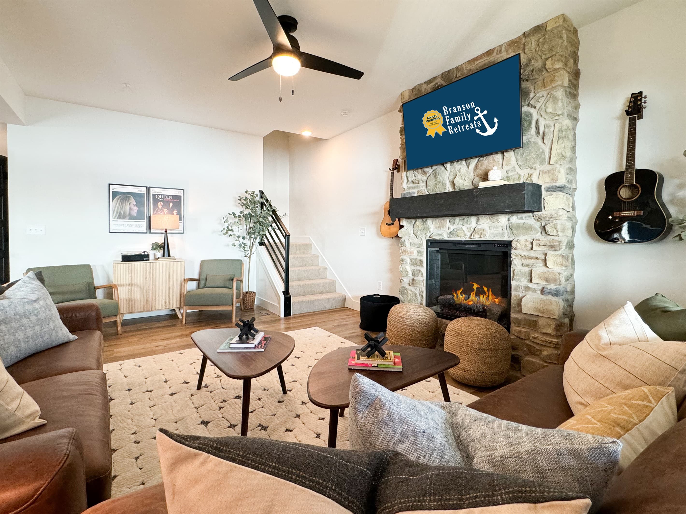 Living room area with stairs to upstairs off of it