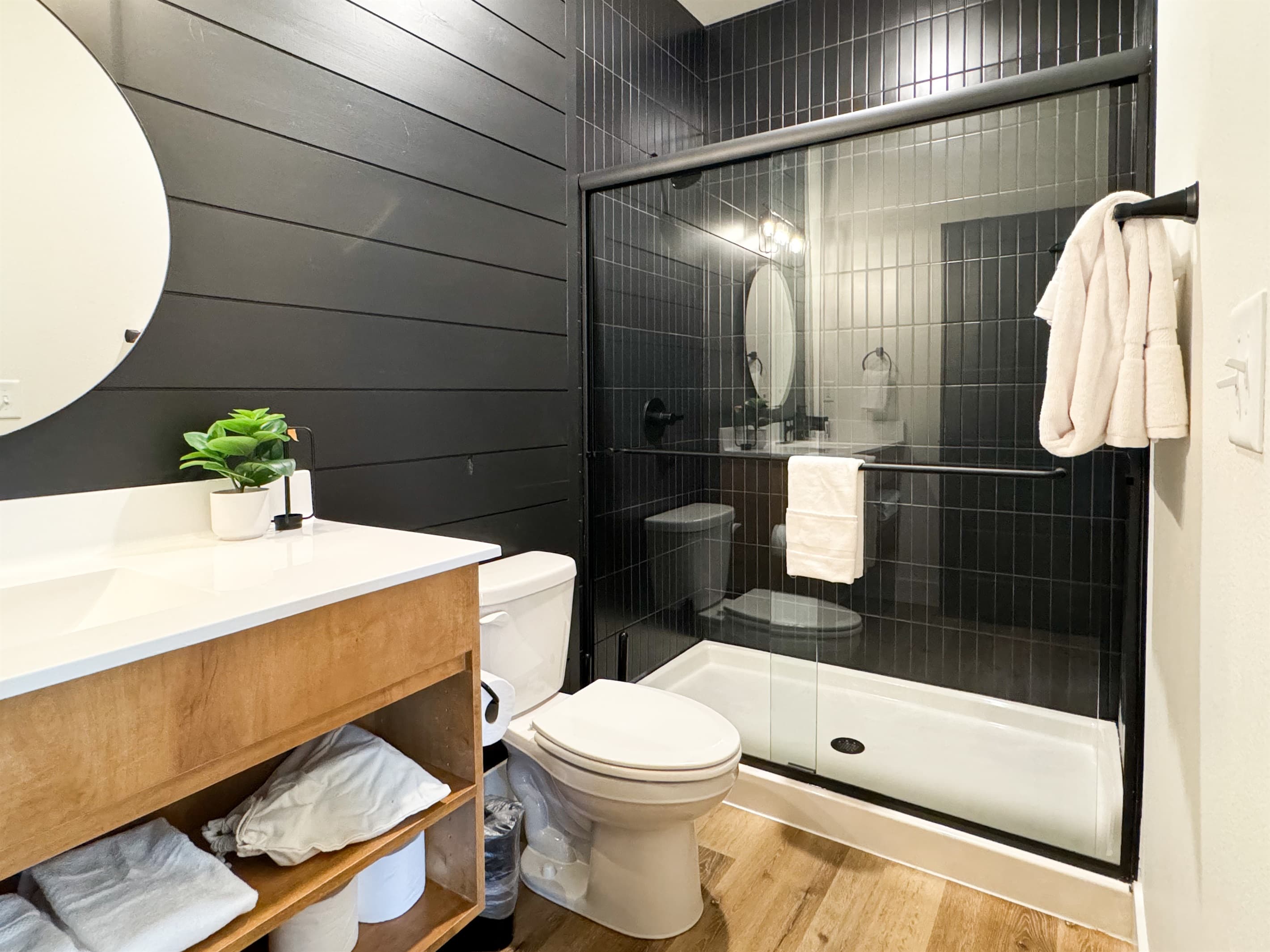 Bedroom 6: En-suite shower with low cub, toilet, and vanity