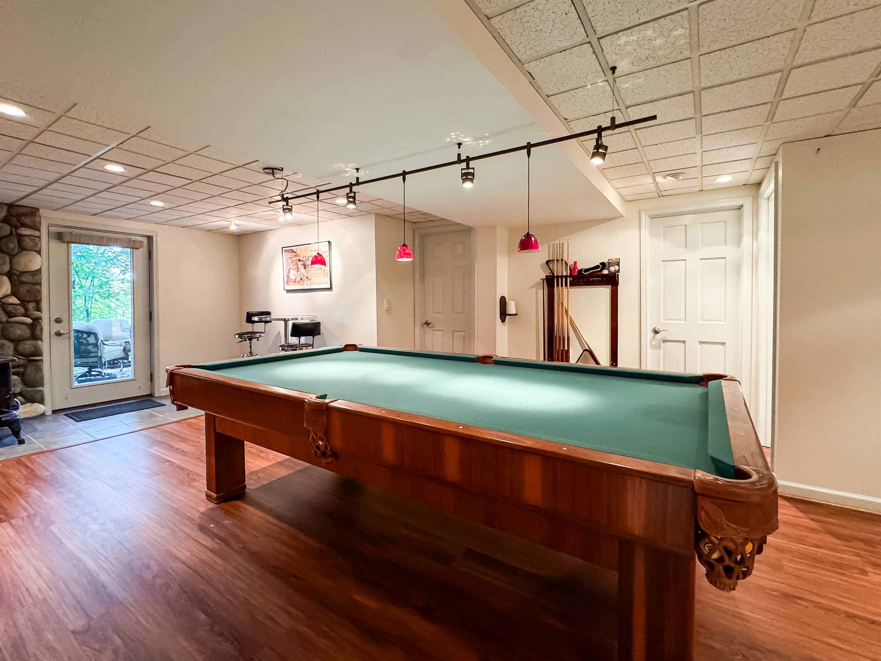 Professional Size Billiard Table with plenty of room for making your best shot on the pool table in the lower level at Pointer Haus.