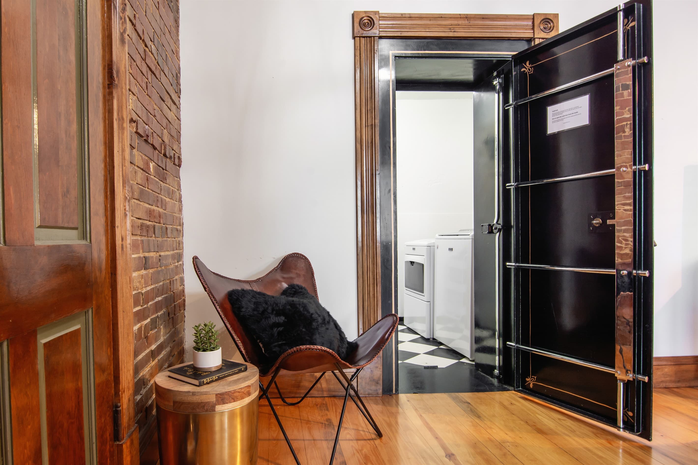 Main level original bank vault turned laundry room. The only place you can "launder" in a bank!
