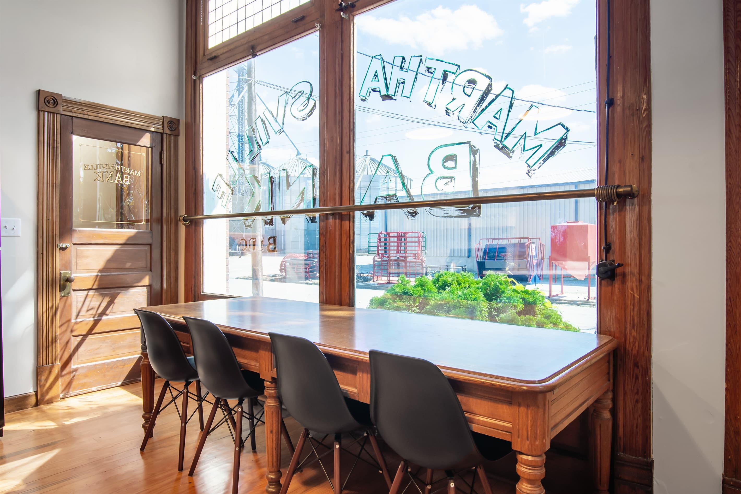 Large kitchen table with seating up to 10 and bright natural light at the Bank Haus