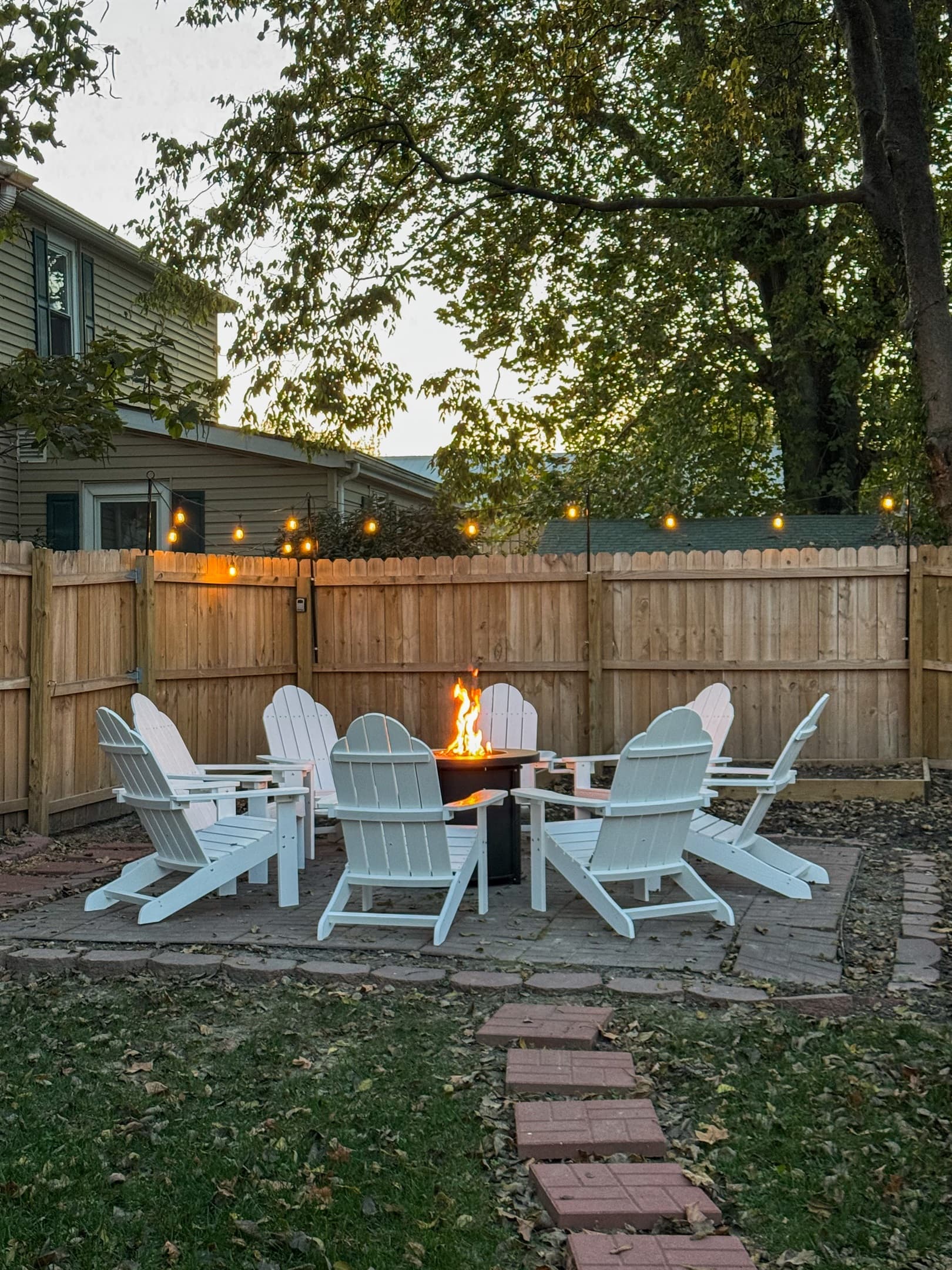 Propane fire pit with ample seating. Private and spacious fully fenced in yard at the Bank Haus