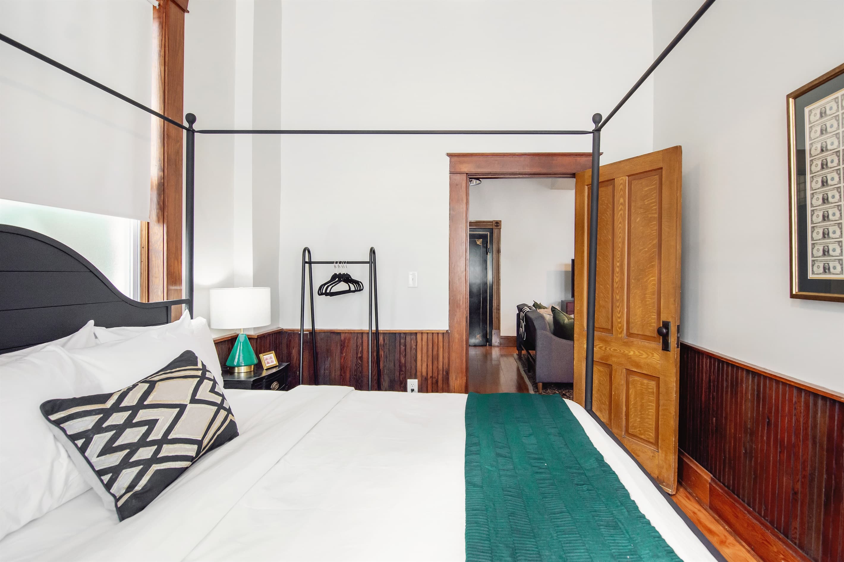 Main level entry to bedroom with king size bed