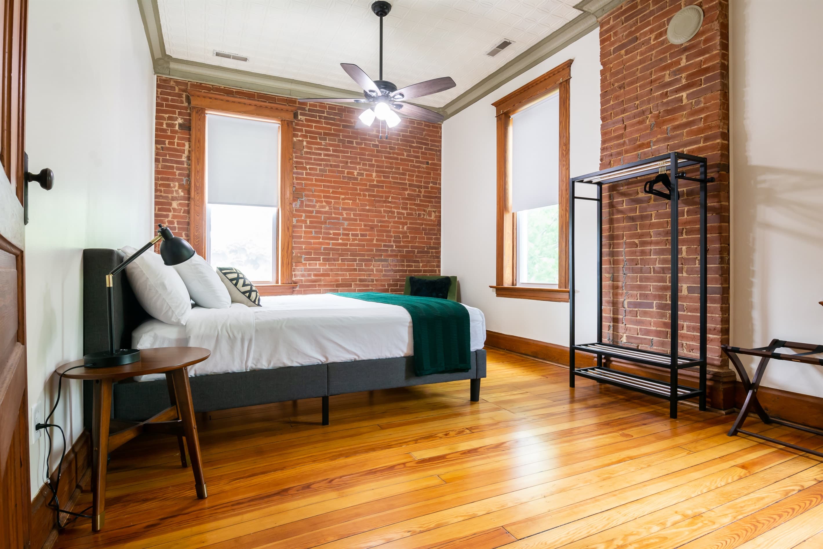 Upper level bedroom with ample space, king size bed, and ensuite bathroom at the the Bank Haus.
