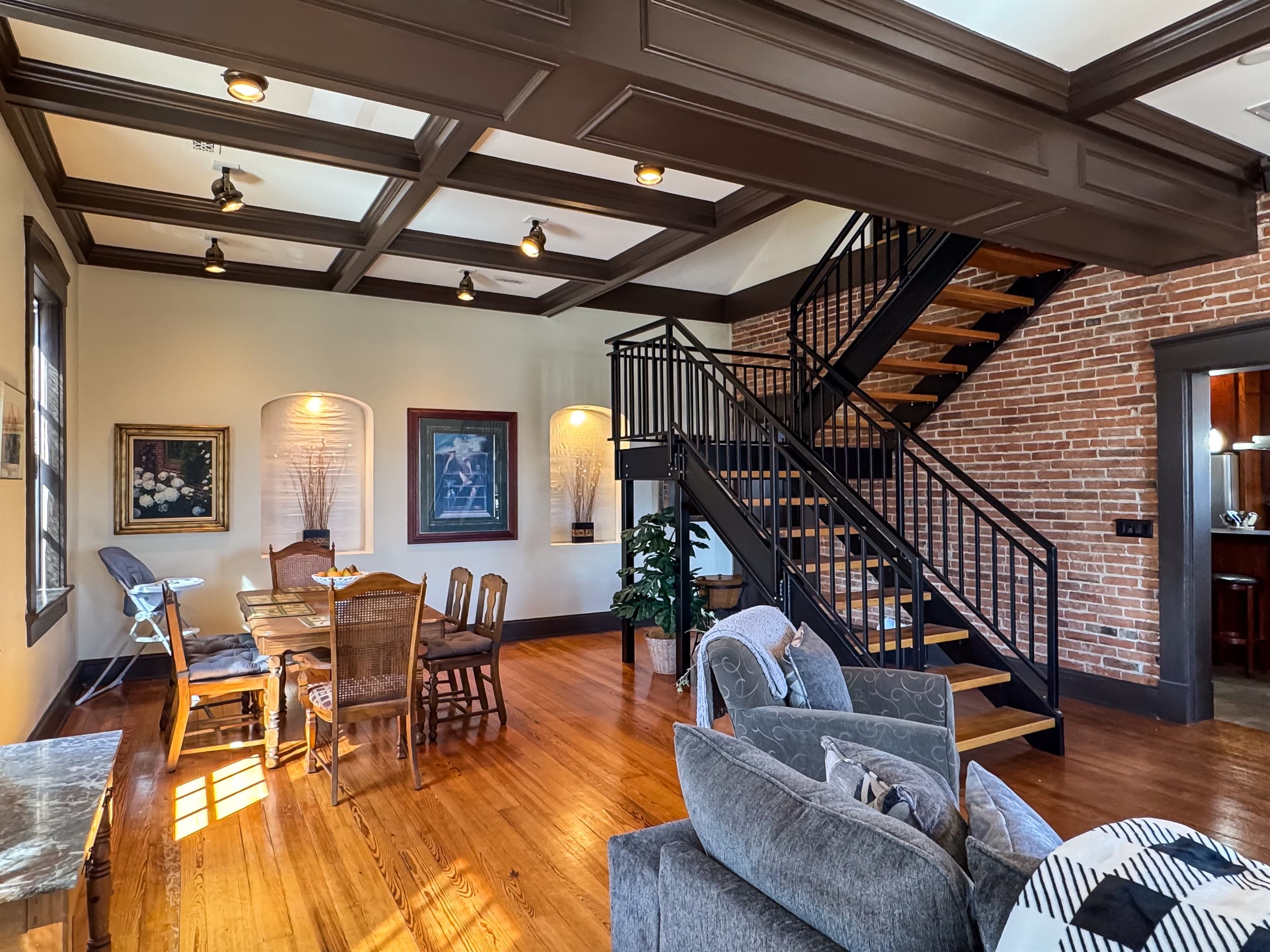 Dining table area made for families/groups to enjoy dinners and game night to escape the busy days of life at Tamm Loft in downtown Washington, MO.