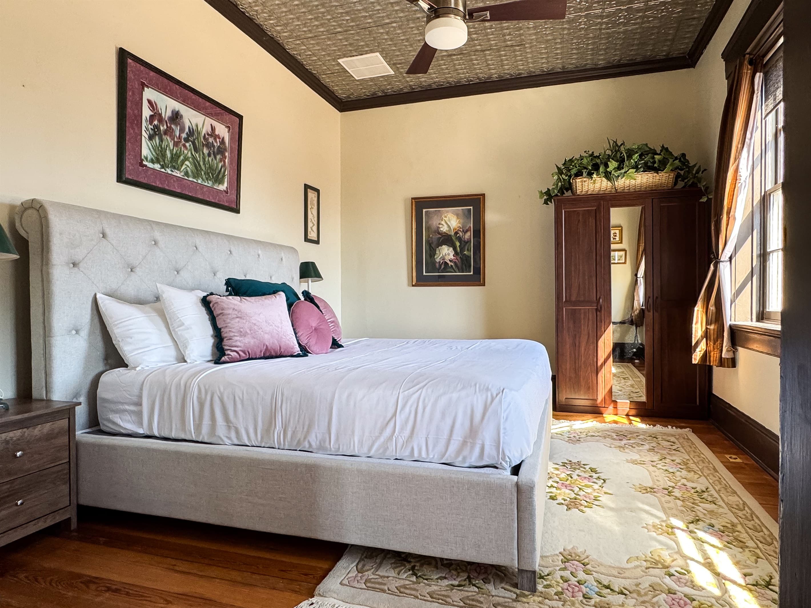 Main level warm and inviting plush King Bedroom with tall ceilings and views of the historic town in Washington, Missouri at Tamm Loft.
