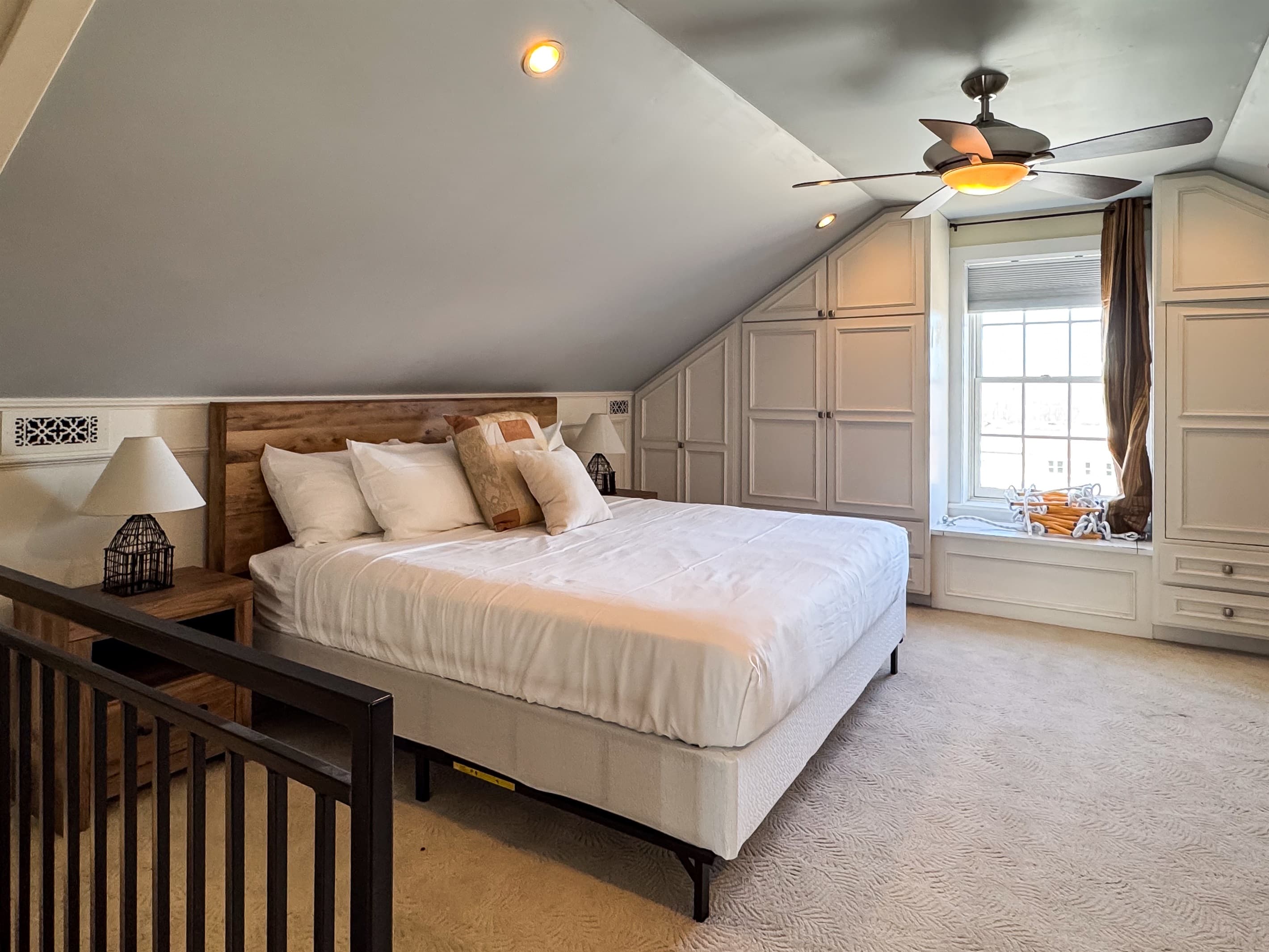 Upper level warm and inviting plush King Bedroom in en suite with river views of the historic town in Washington, Missouri at Tamm Loft.