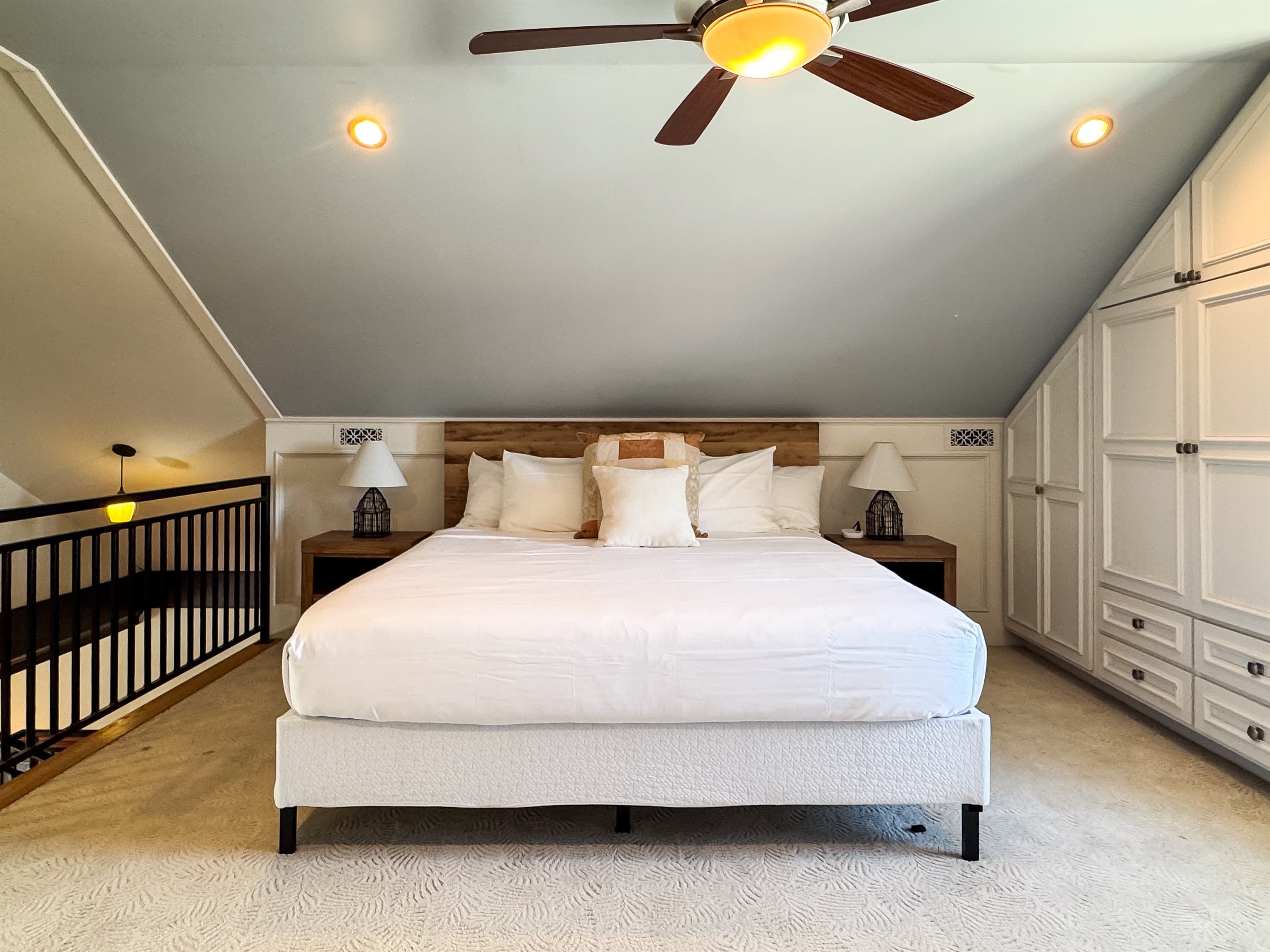 Upper level warm and inviting plush King Bedroom in en suite with river views of the historic town in Washington, Missouri at Tamm Loft.