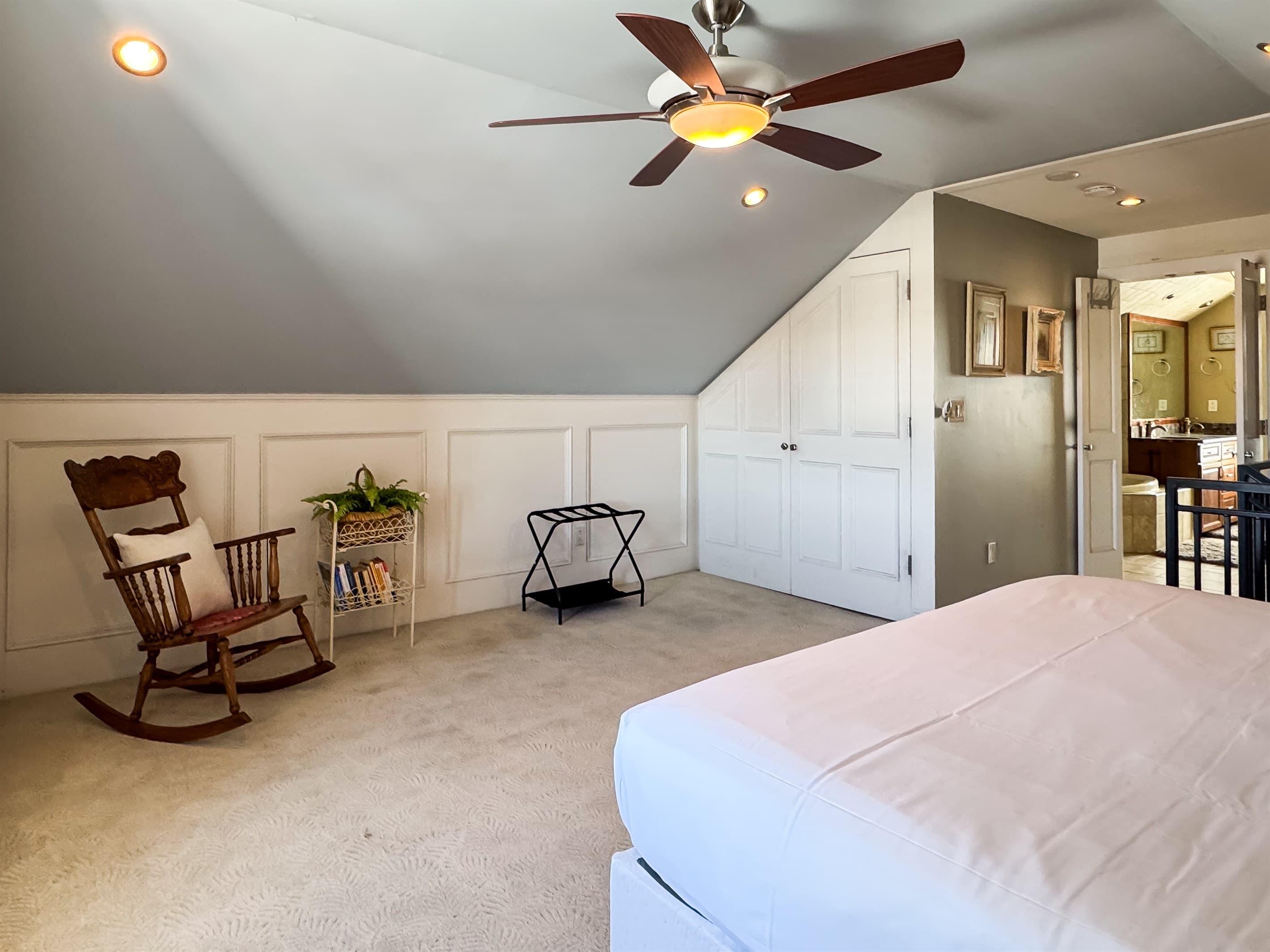 Upper level warm and inviting plush King Bedroom in en suite with river views of the historic town in Washington, Missouri at Tamm Loft.