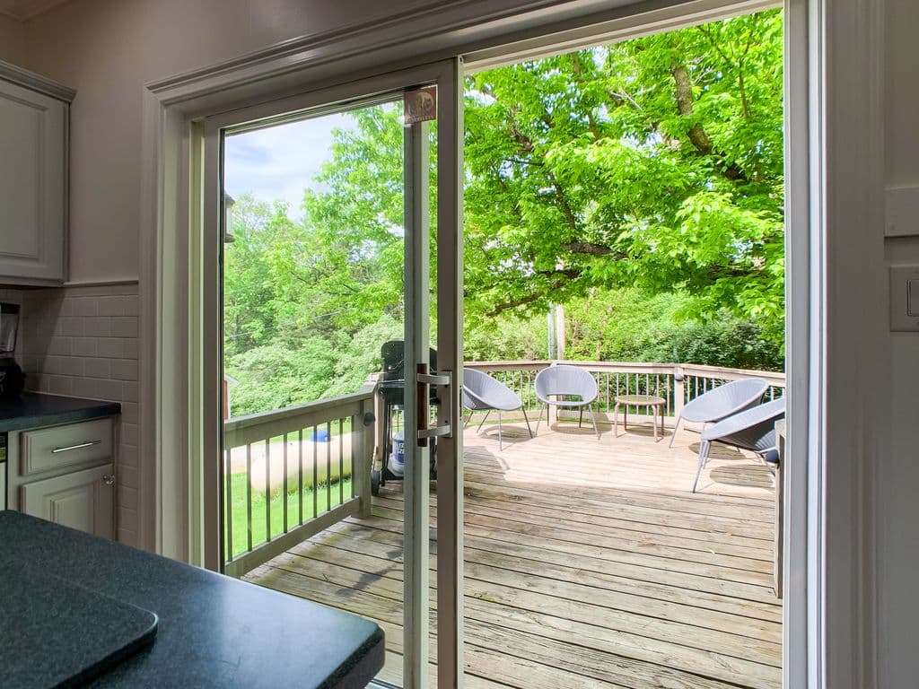 Main level kitchen with access to outdoor deck and gas grill at Setter Haus.