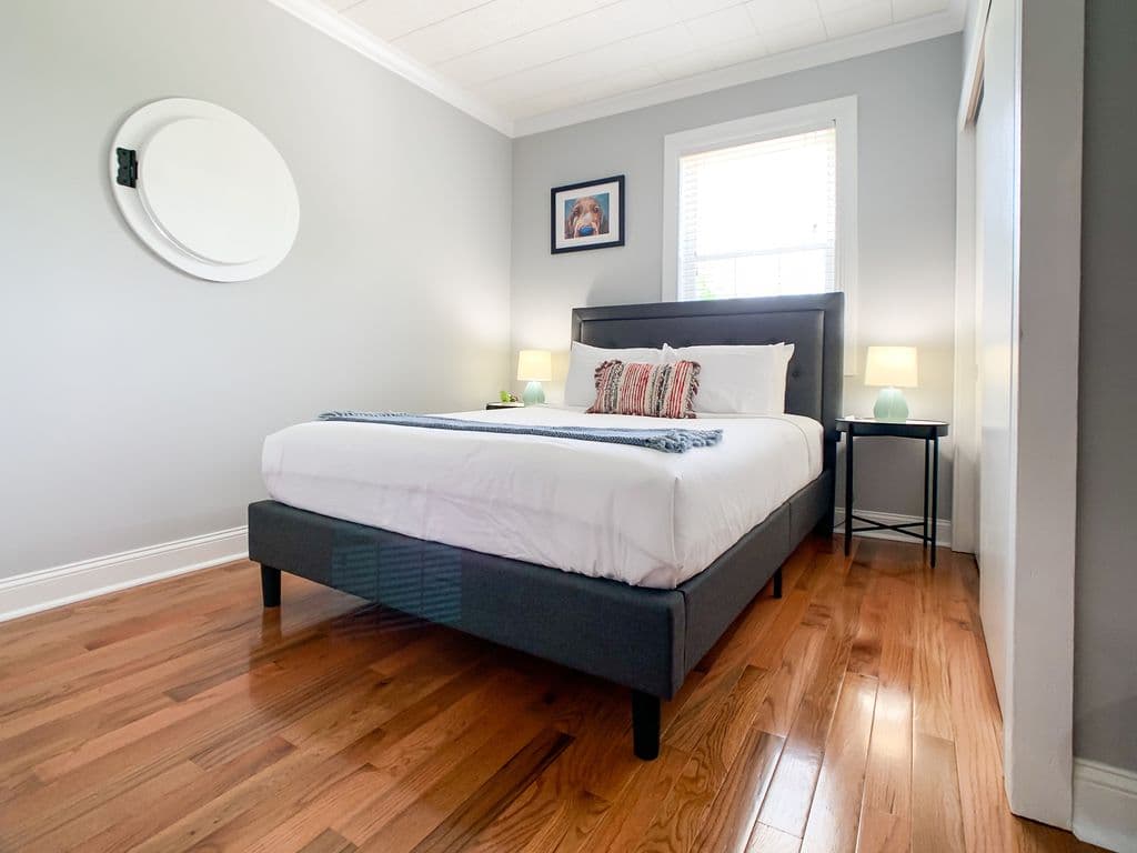 Main level bedroom 1 with queen bed, full closet and smart TV.