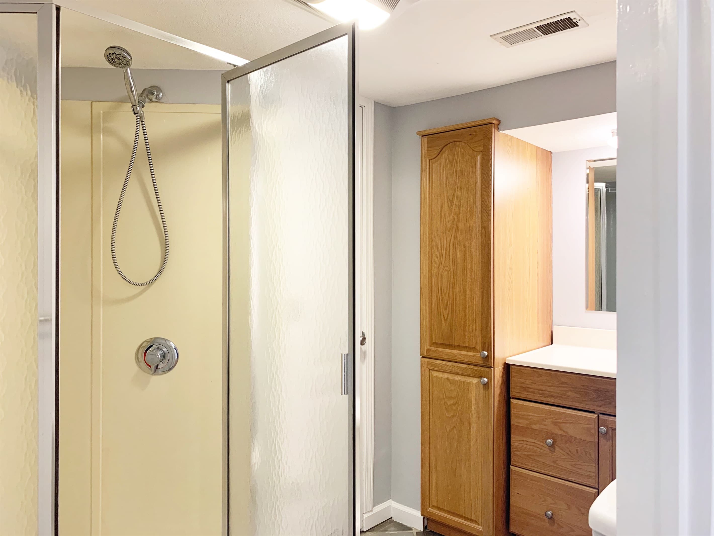 Lower level bathroom with stand up shower and ample bathroom storage at Setter Haus