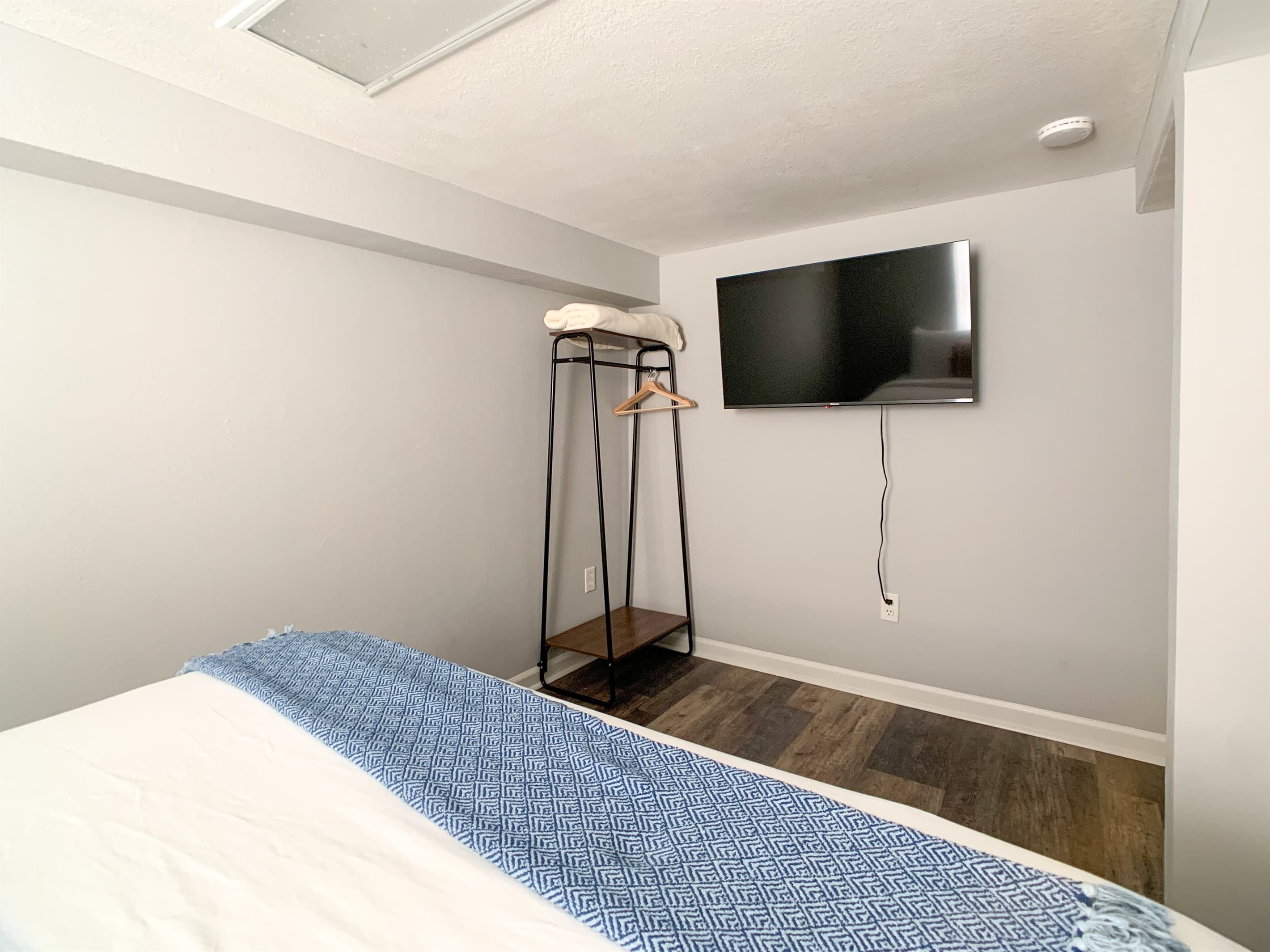 Lower level bedroom 4 with TV