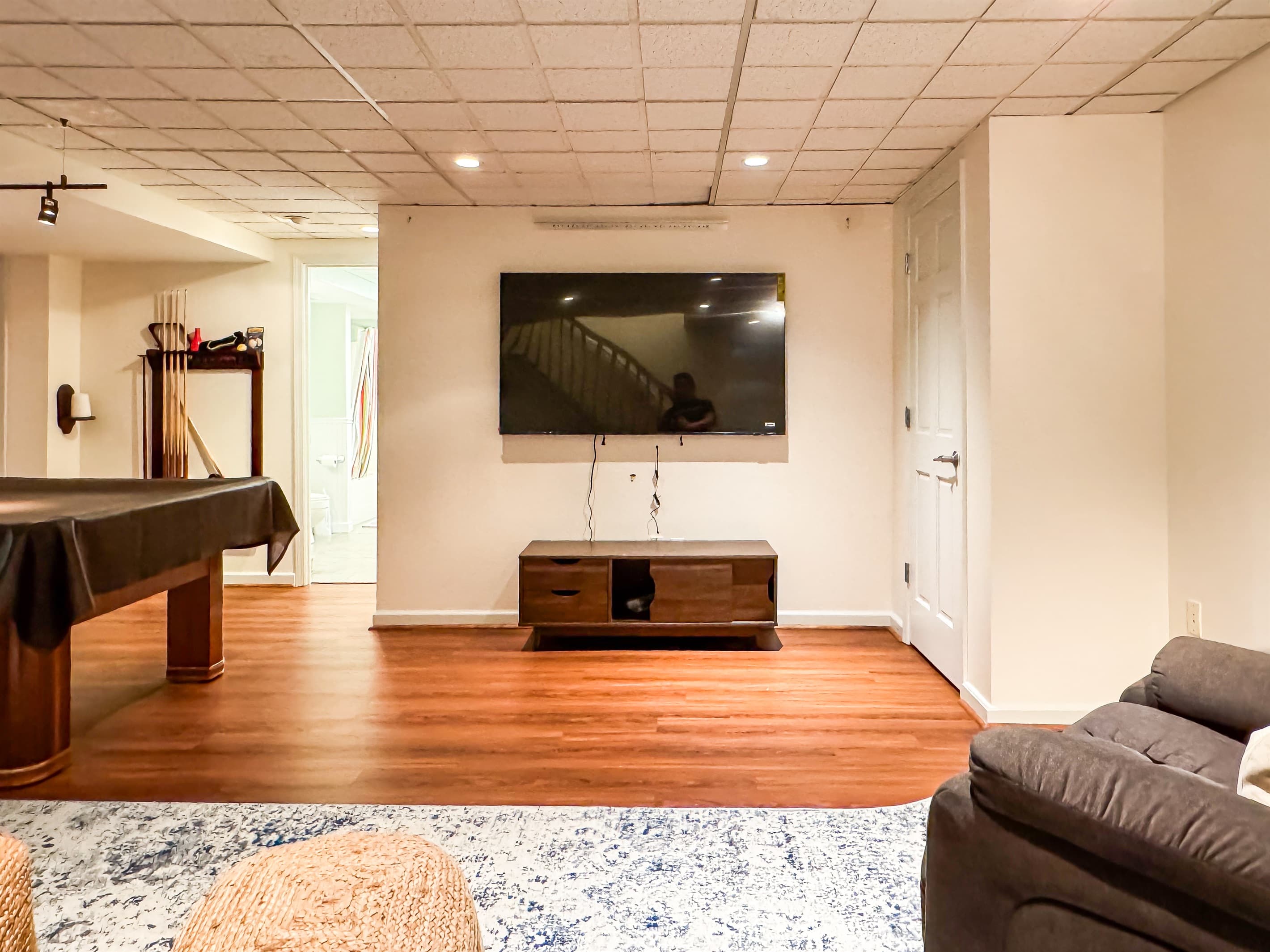 65 inch smart TV in a spacious lower level entertainment room at Pointer Haus.