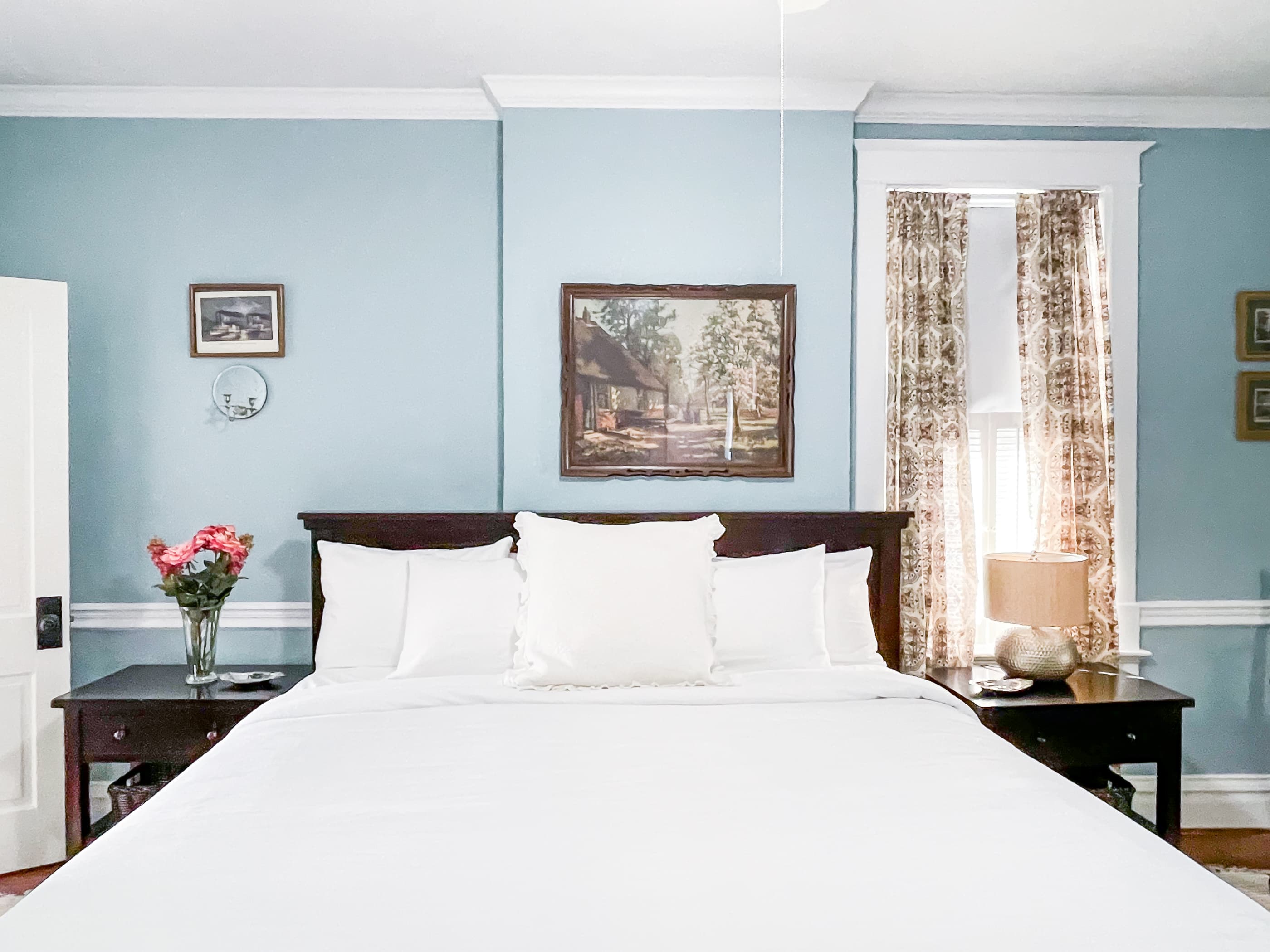Mill Haus spacious blue bedroom has with a King bed with tons of natural light with en suite full bathroom on the second floor.
