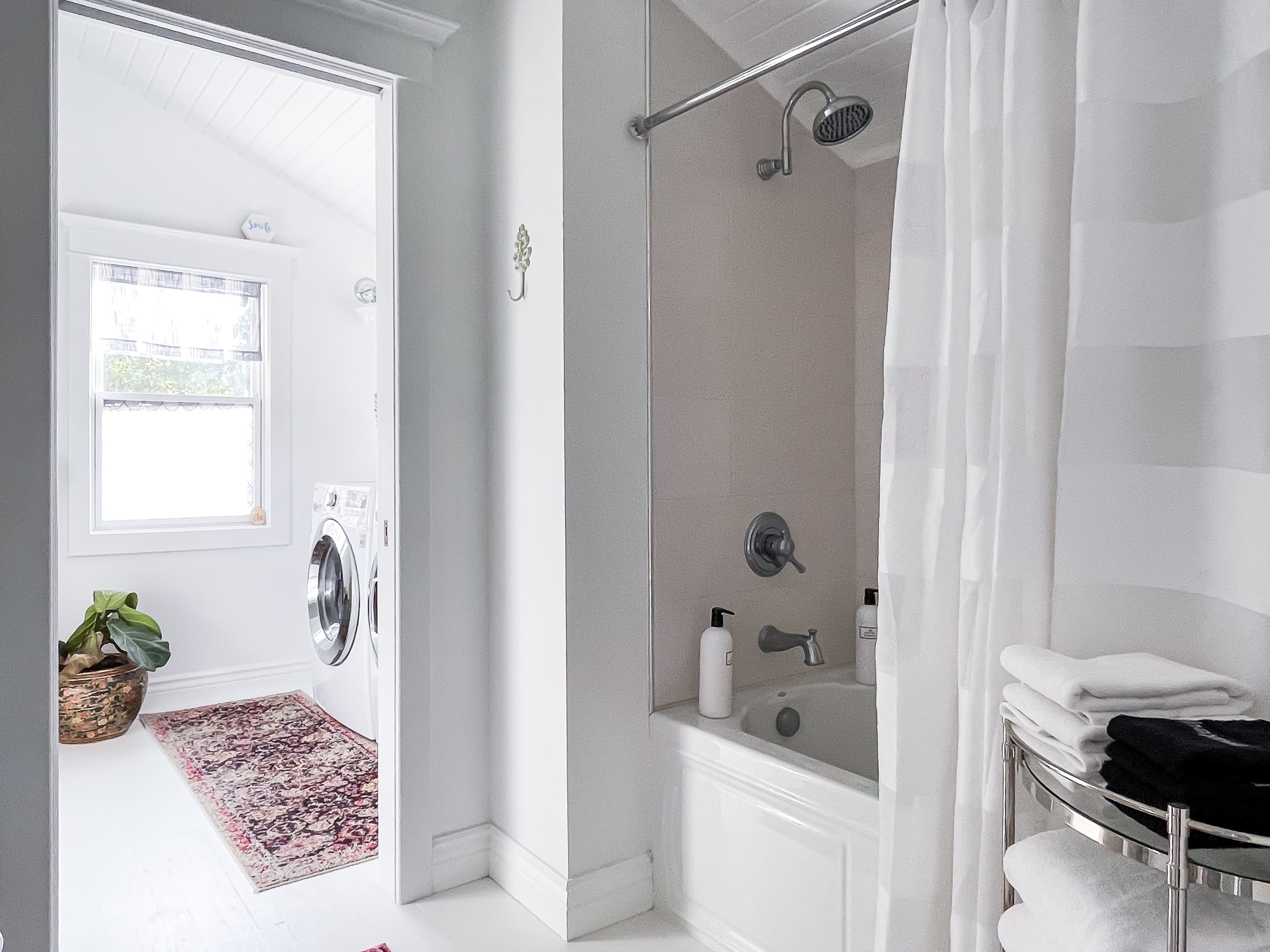 En suite bathroom with tub/shower combo to the blue bedroom on the second floor at Mill Haus 