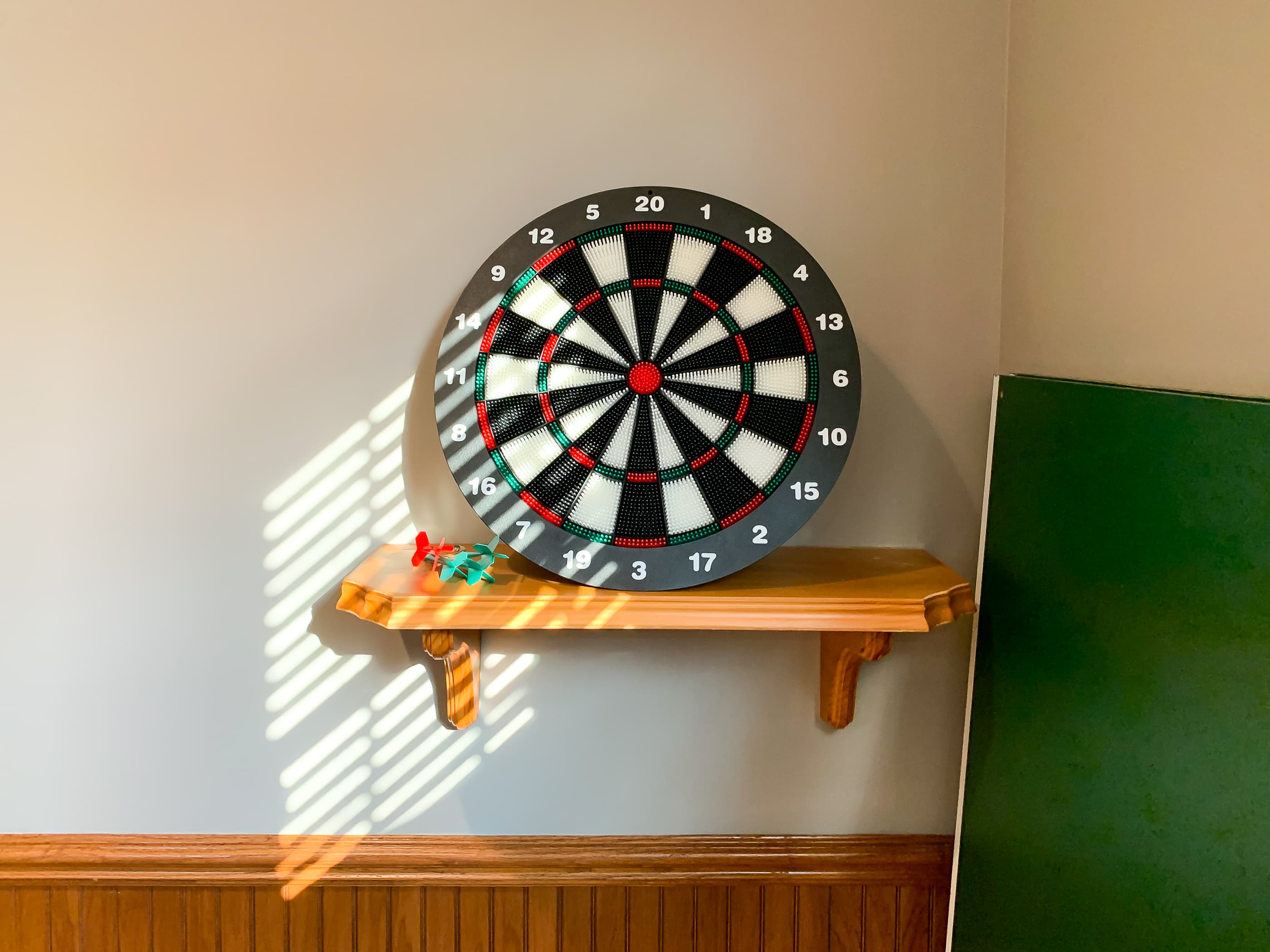 OPTIONAL ADD ON: Spacious game room above the garage that includes a dart board for competitive family/friend game night.