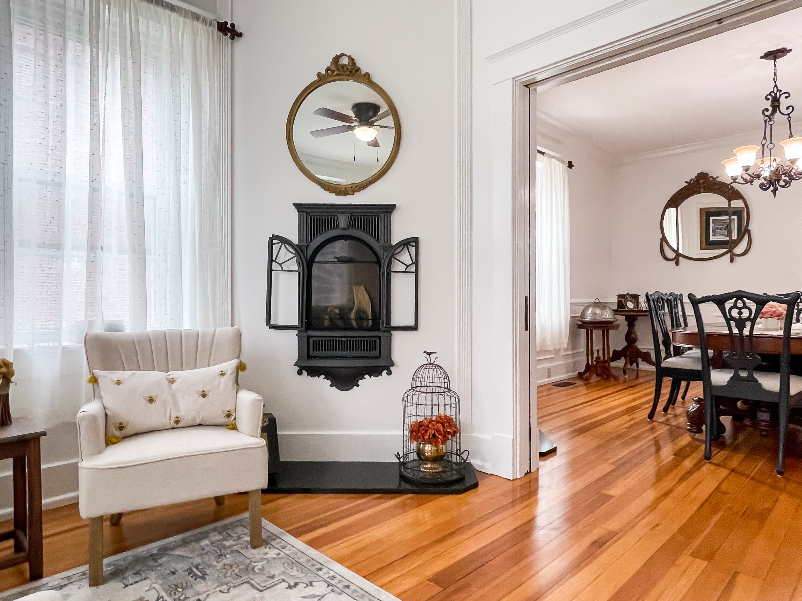 The Beekeeper's Cottage living area on the main level is an open spacious floor plan showcasing the century old fireplace and hardwood floors,