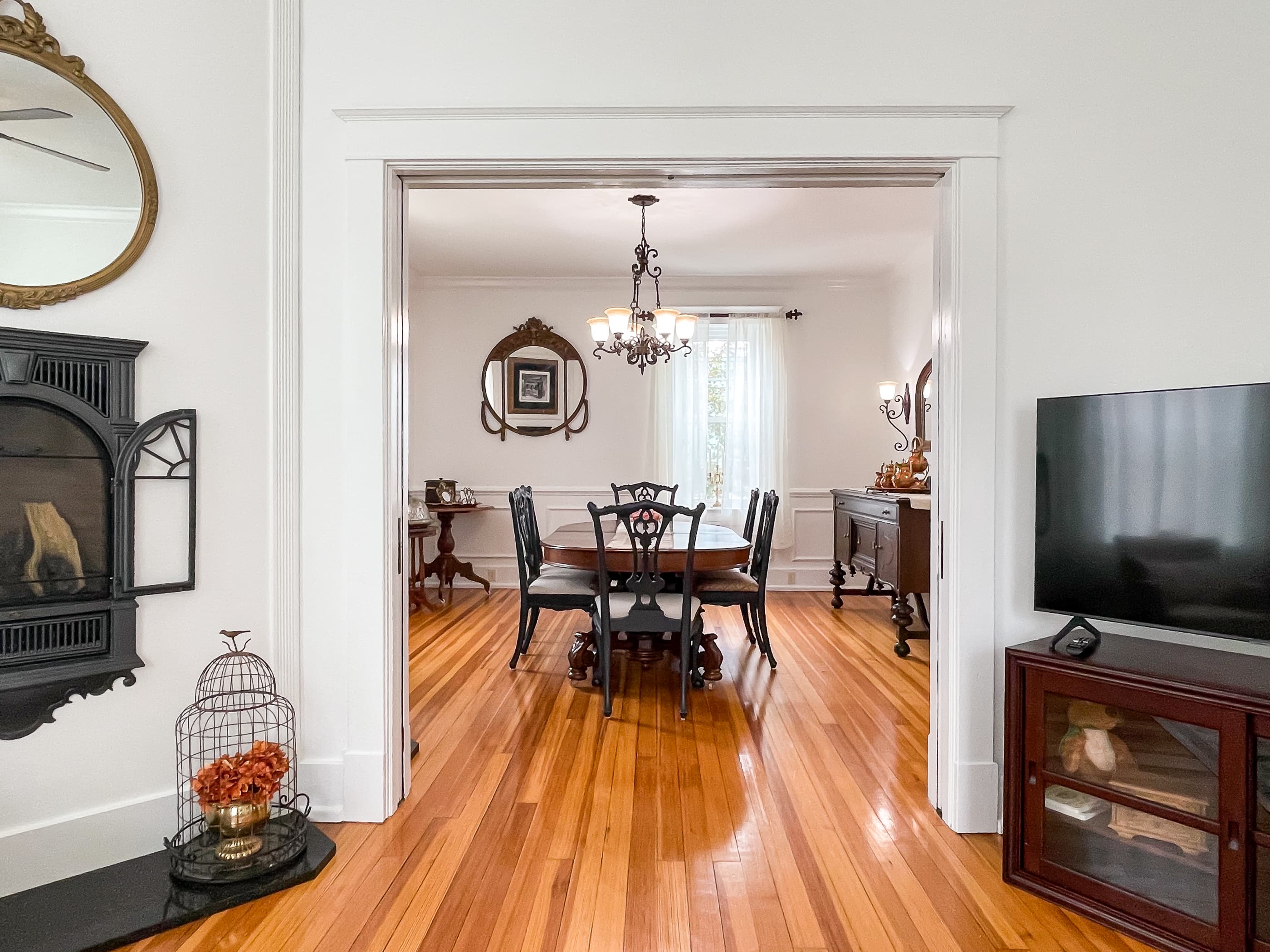 The large dining area through the double sliding pocket doors includes a gorgeous hardwood dining table and seating for 6 people at The Beekeeper's Cottage.