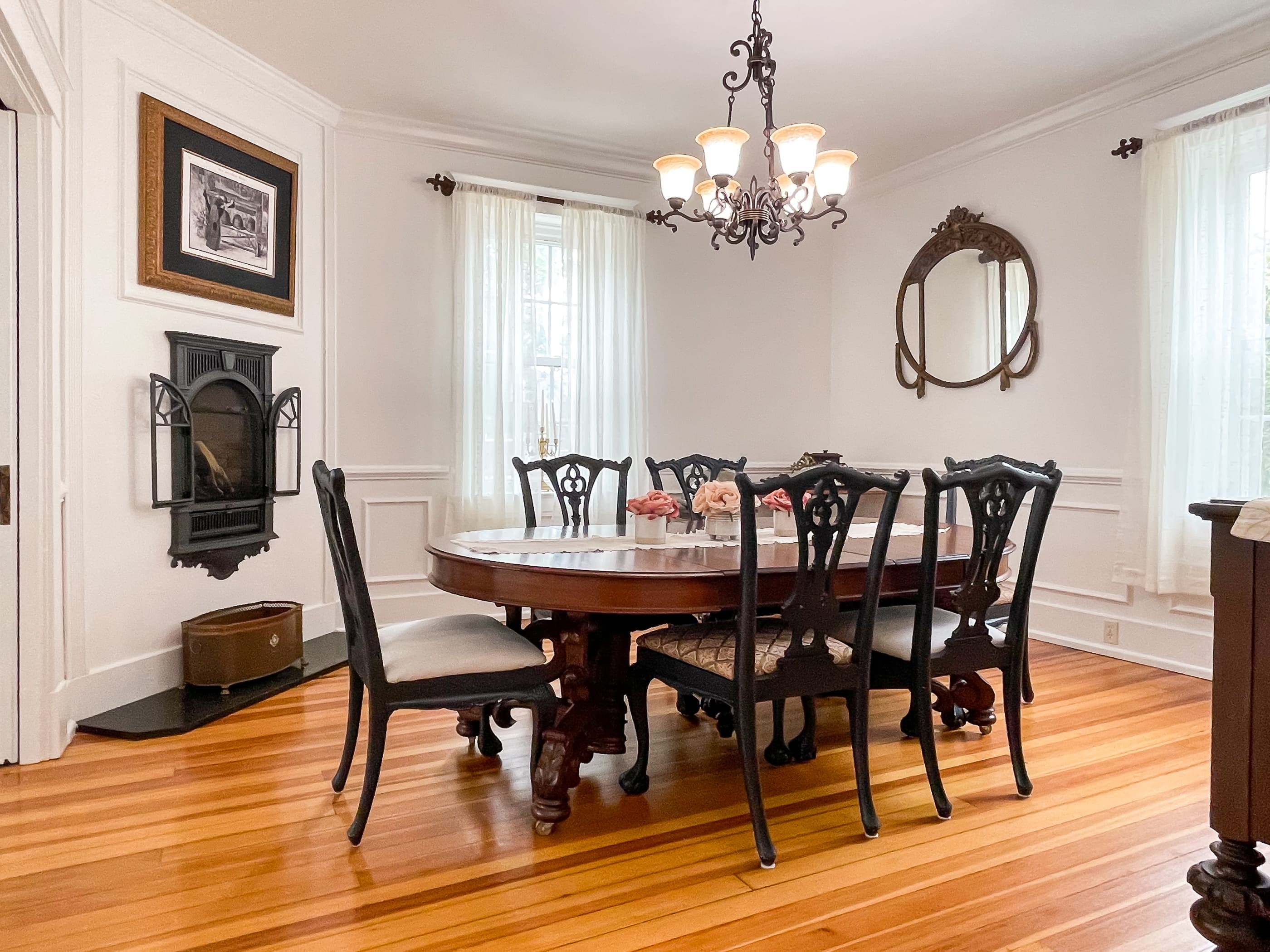 The large dining area includes a gorgeous hardwood dining table and seating for 6 people for family dinners or game night at The Beekeeper's Cottage.