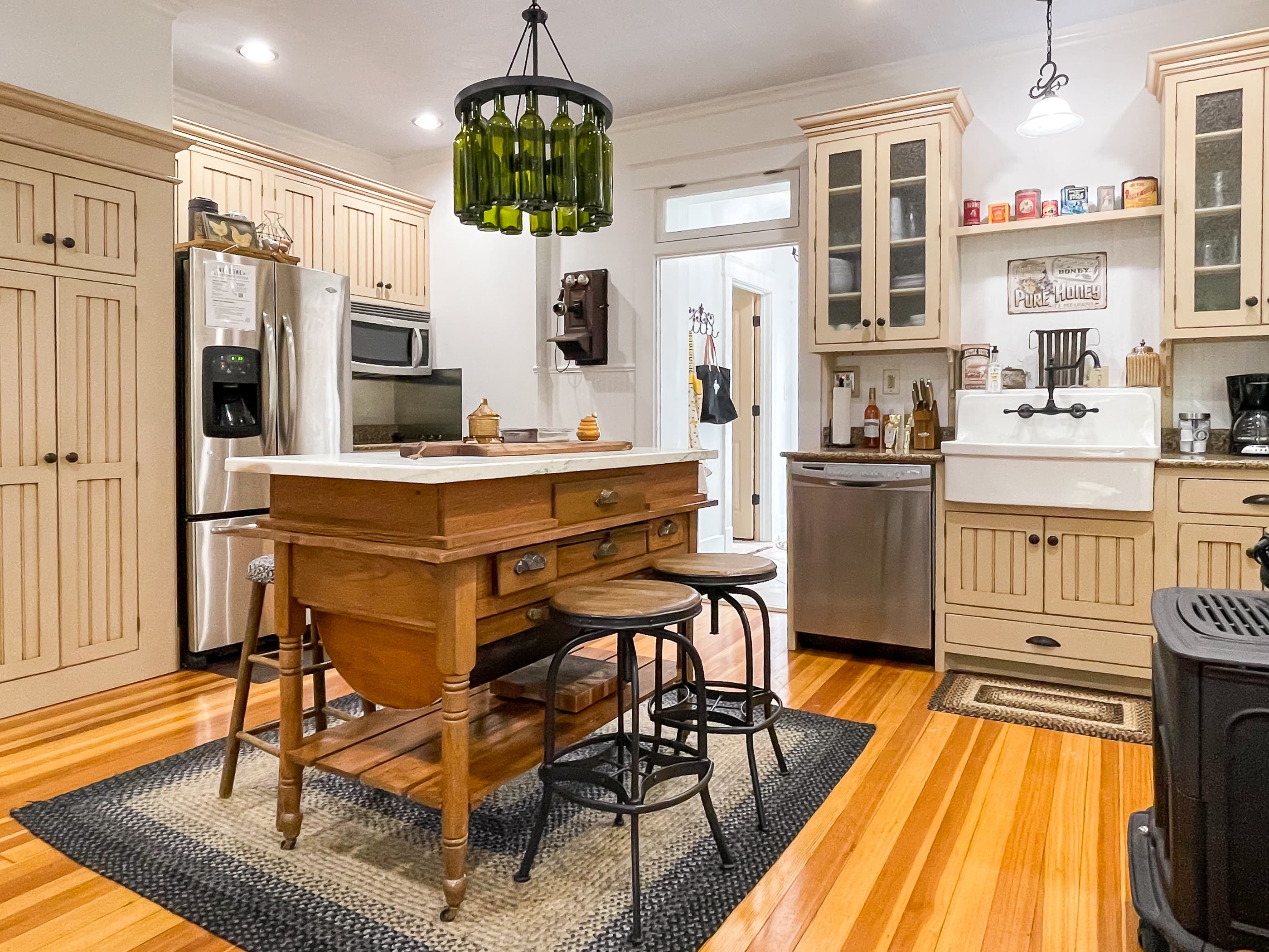 The beautifully detailed full kitchen has everything you need to make your own meals, including place settings, pots and pans, wine glasses, and a regular coffee maker or a Keurig at The Beekeeper's Cottage.