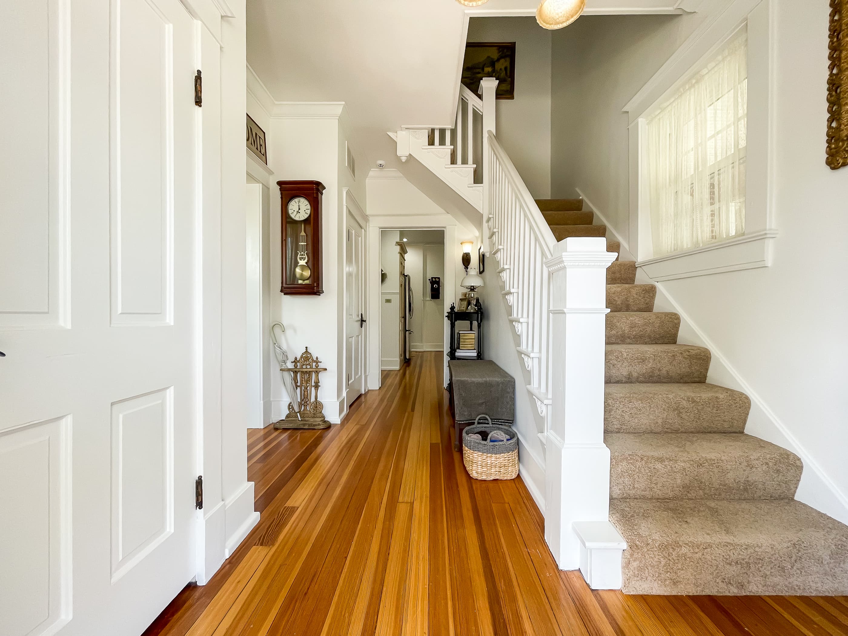 Up a flight of 100 year old stairs, the upper level has all three bedrooms and both of the full bathrooms at The Beekeeper's Cottage.