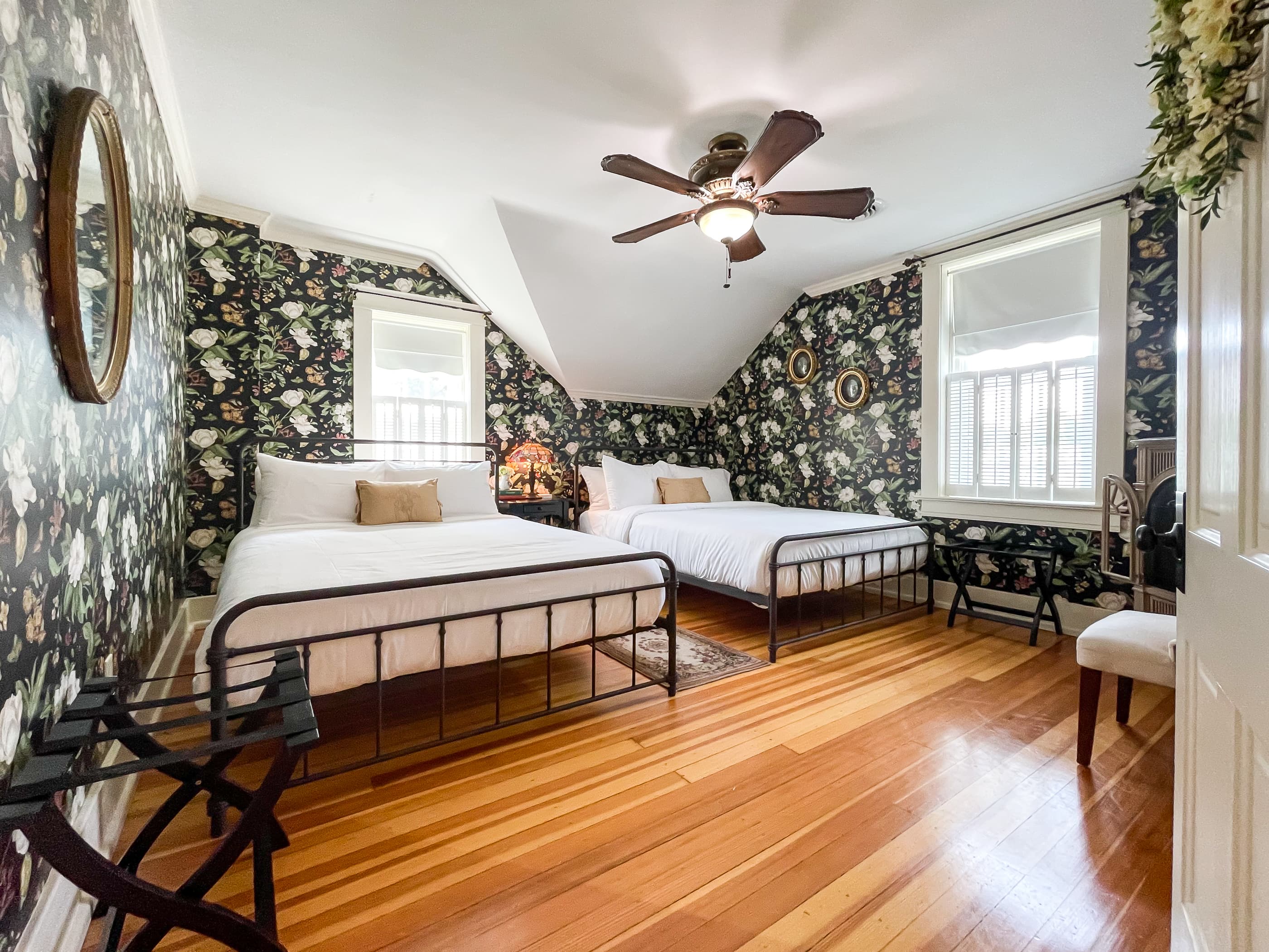 Large roomy bedroom 2 has two queen size beds with crisp white linens and share the second full bathroom in the hallway that includes a gorgeous clawfoot tub. 
