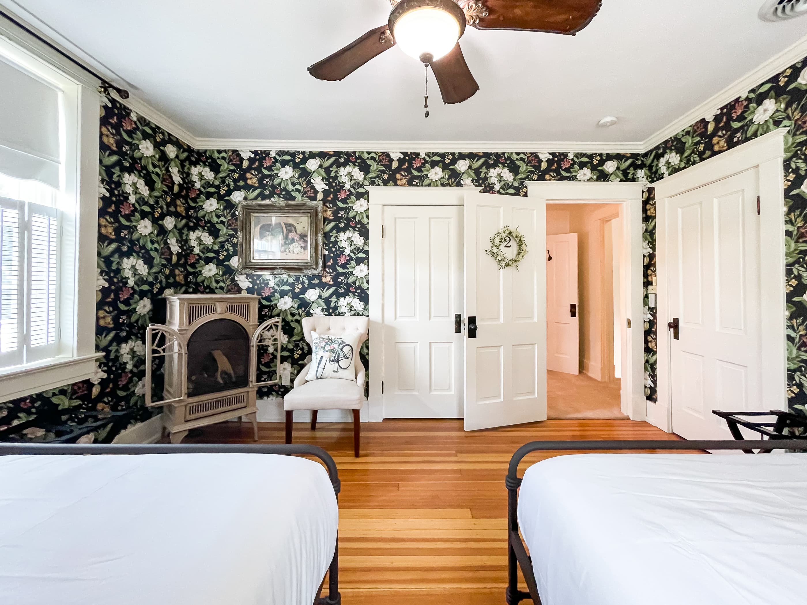 Large roomy bedroom 2 has two queen size beds with crisp white linens and share the second full bathroom in the hallway that includes a gorgeous clawfoot tub. 